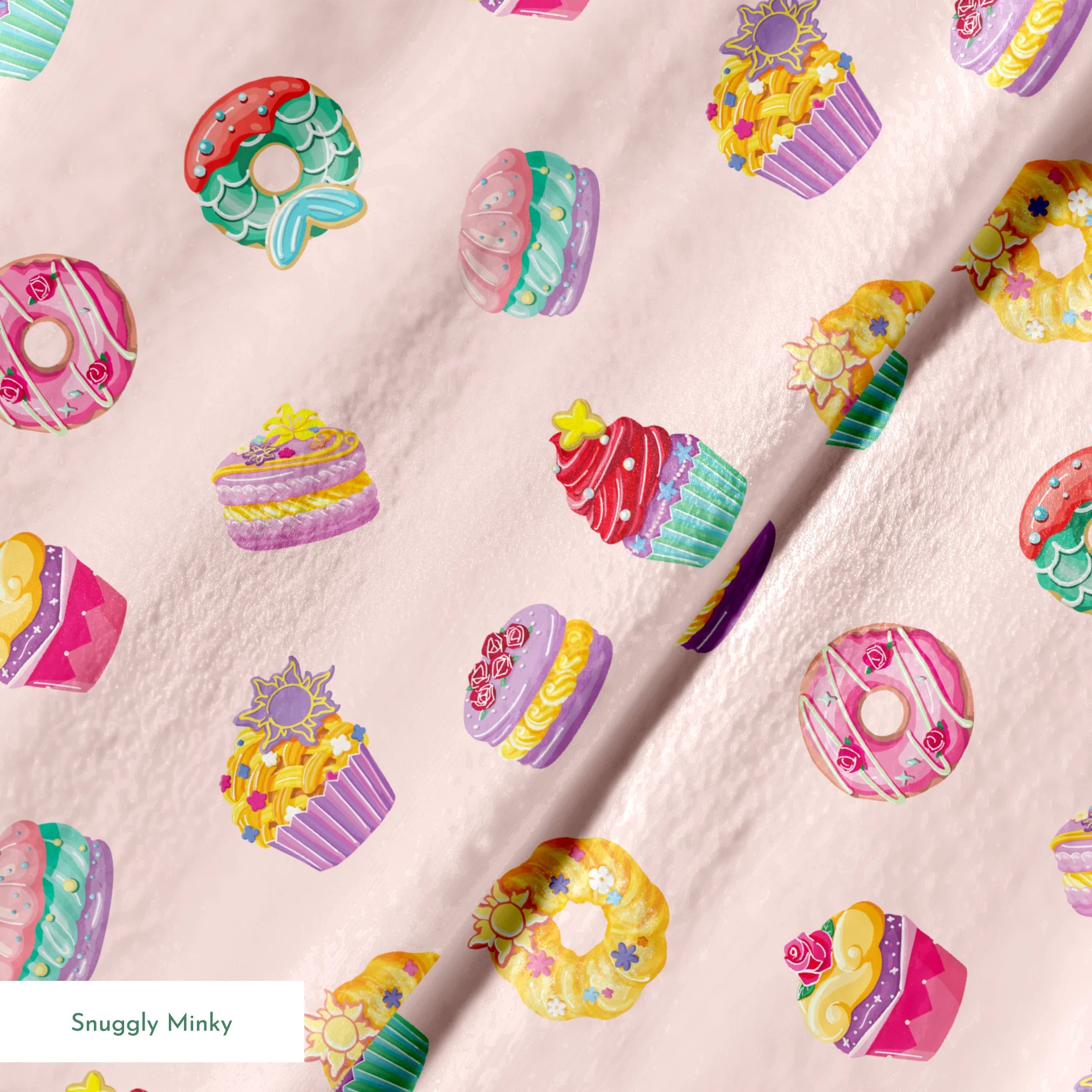 DIsney Princess-inspired dessert pattern with donuts, cupcakes, and macarons on a light pink background springs minky texture