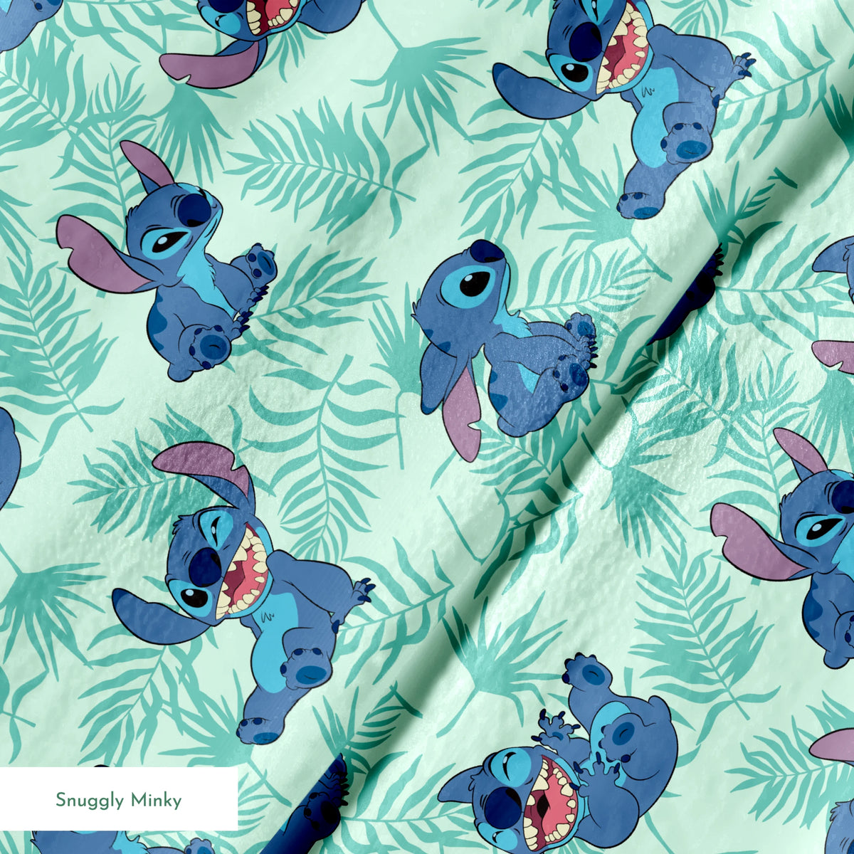 Blue cartoon alien character Stitch in various playful poses against mint green tropical leaf pattern background springs minky texture