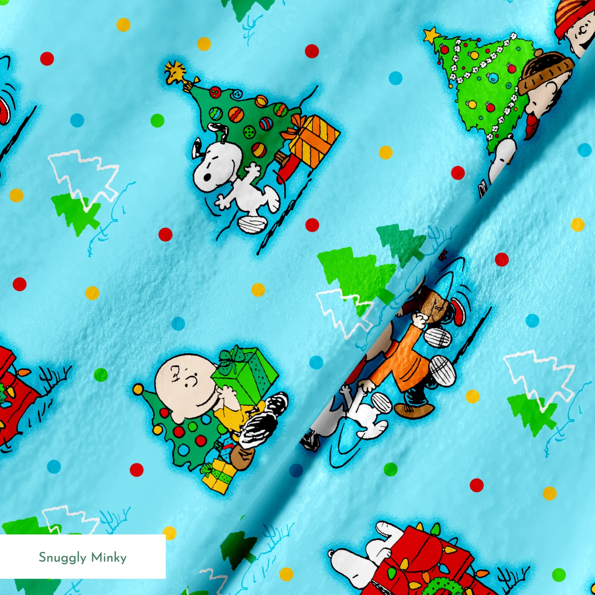 Peanuts Christmas pattern with Snoopy, Charlie Brown, and friends decorating trees on light blue background springs minky texture