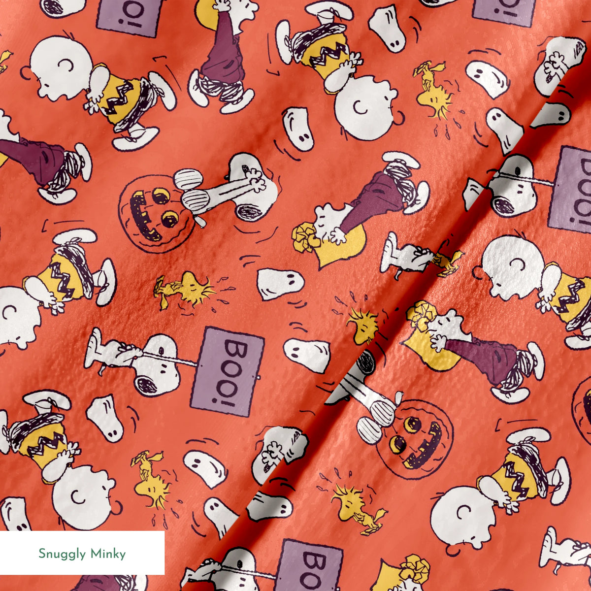 Snoopy and Woodstock Halloween pattern on orange background with pumpkins, ghosts, and "boo" text springs minky texture