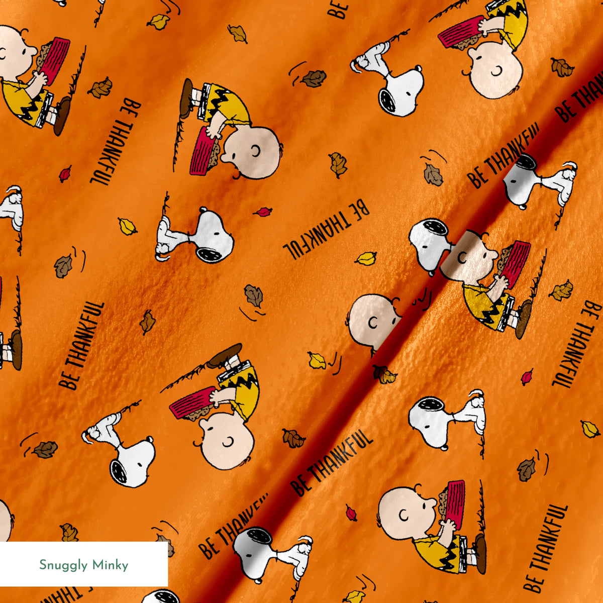 Peanuts characters on orange background with autumn leaves and "Be Thankful" text pattern springs minky texture