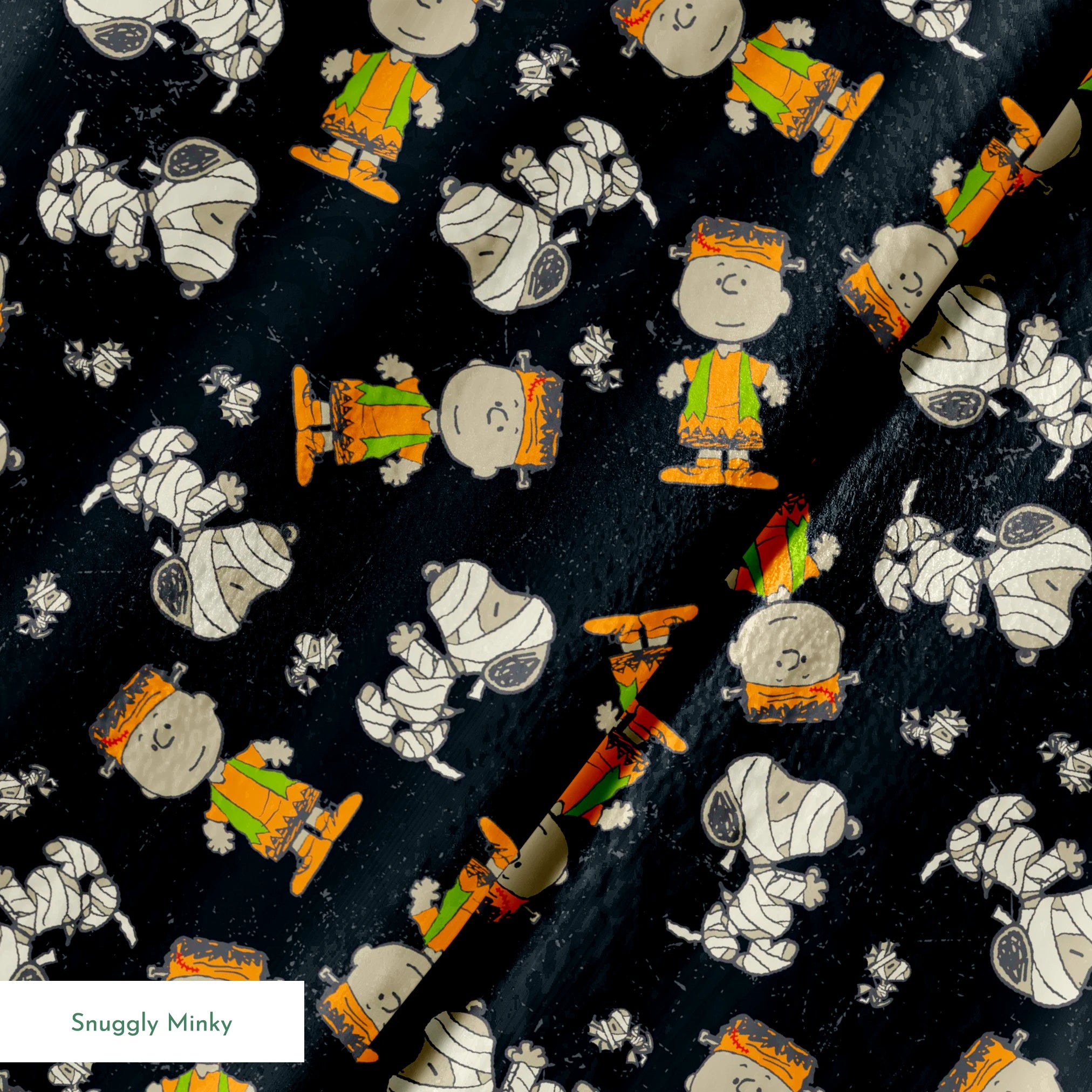 Peanuts characters pattern on black background featuring Snoopy and Charlie Brown in fall outfits springs minky texture