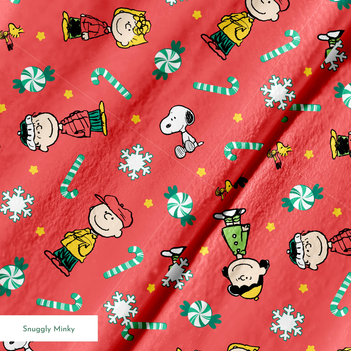 Festive Peanuts cartoon pattern with Charlie Brown characters, candy canes, snowflakes, and peppermints on red background springs minky texture