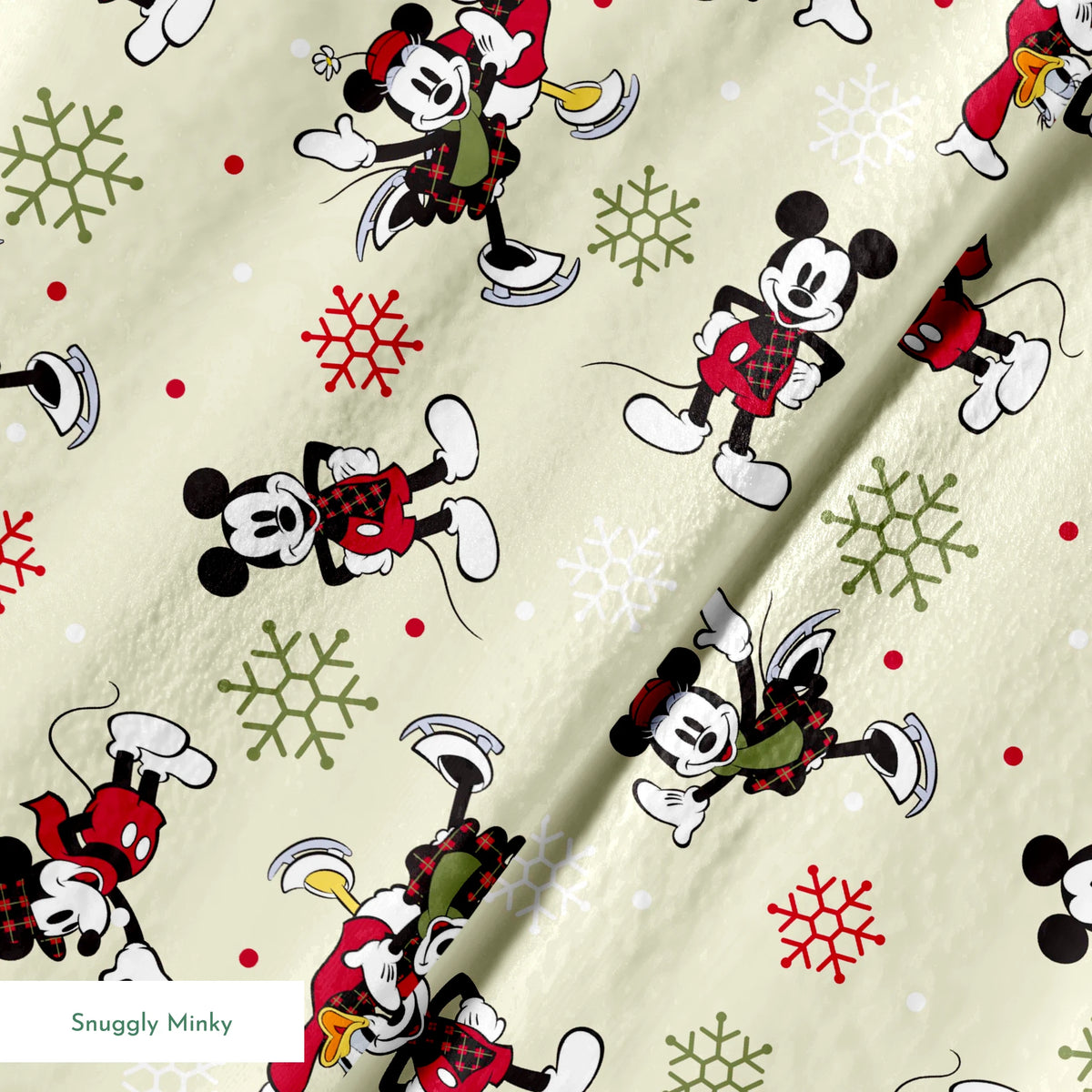 Holiday-themed cartoon mouse pattern with classic characters in red outfits on beige background with snowflakes. springs minky texture
