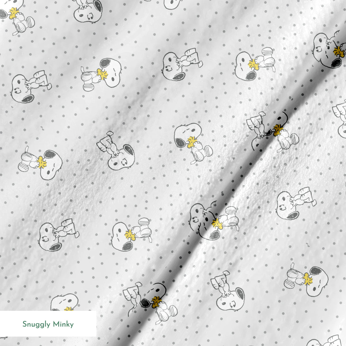Snoopy and Woodstock on polka dot background in a repeating pattern springs minky texture