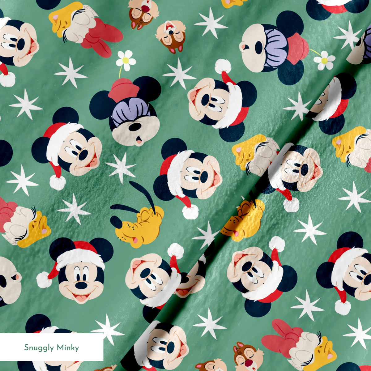Mickey Mouse holiday pattern with characters wearing Santa hats on green background with stars and ornaments springs minky texture