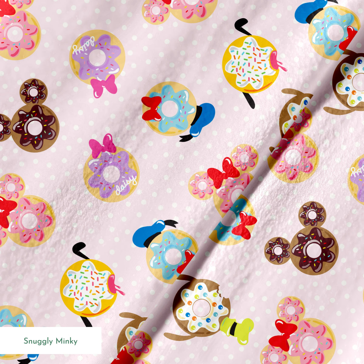 Mickey Mouse & friends donuts in various shapes on a pink polka dot background. springs minky texture