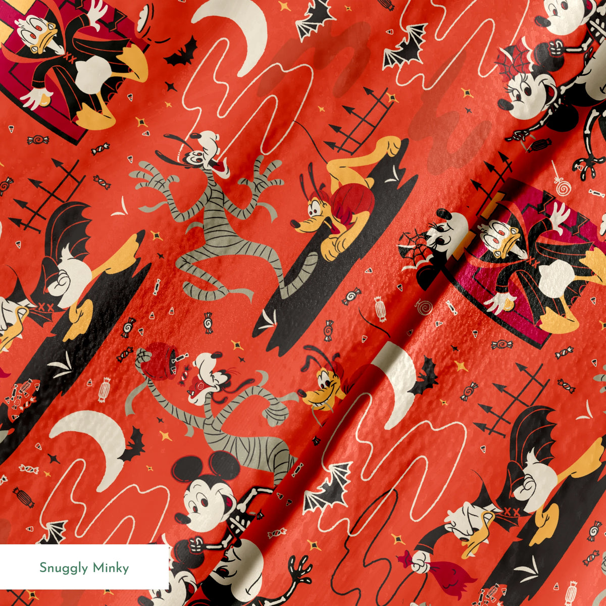 Halloween-themed Disney pattern with Mickey, Minnie, Donald in skeleton costumes on orange background with bats and moons springs minky texture