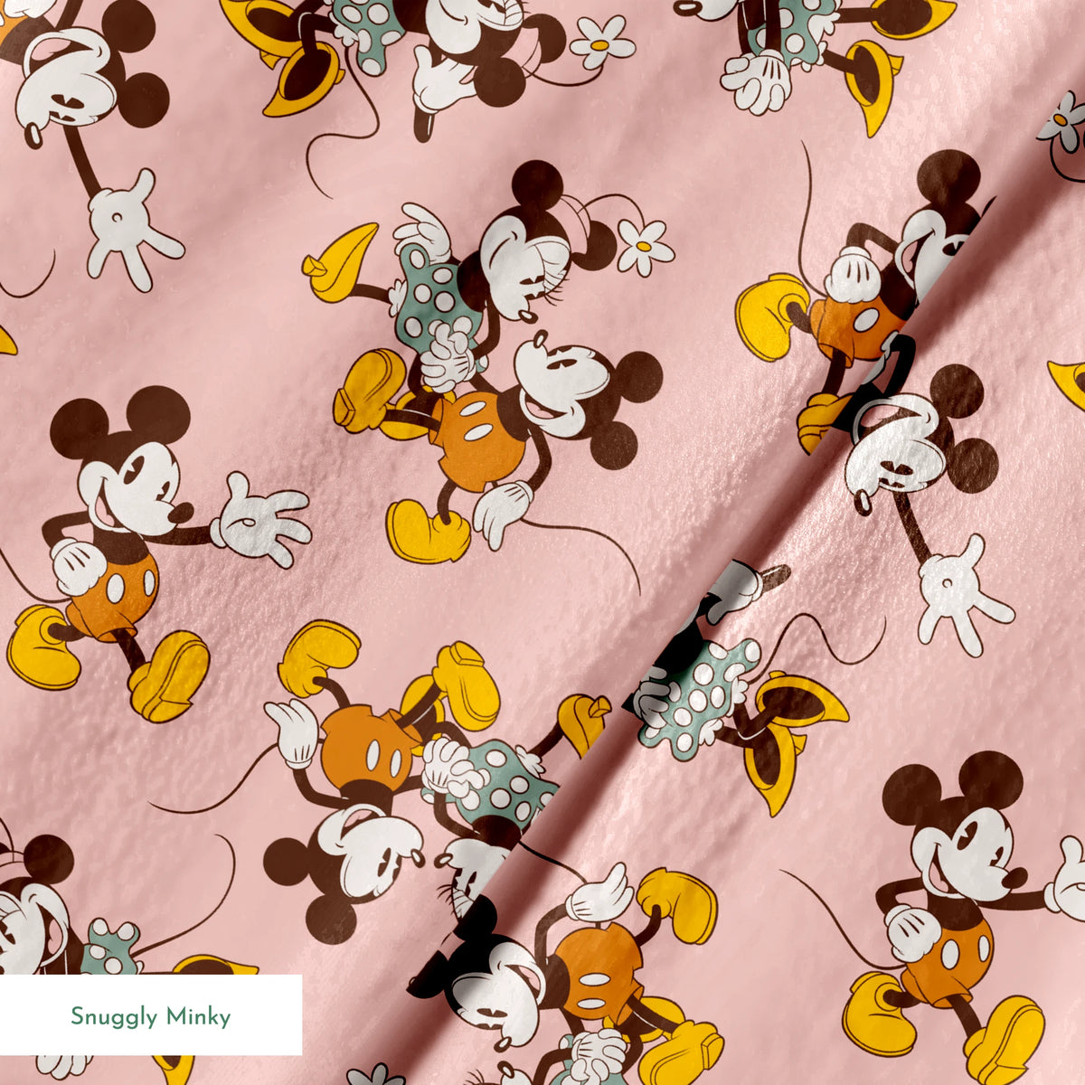 Mickey and Minnie Mouse characters in vintage style on pink background with repeated pattern springs minky texture