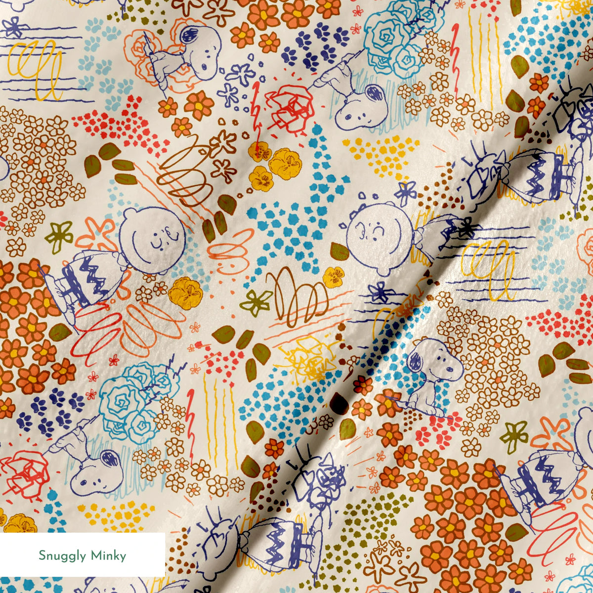 Colorful pattern with Peanuts characters sketches, floral designs, and dots in orange, blue, yellow, and green on a cream background springs minky texture