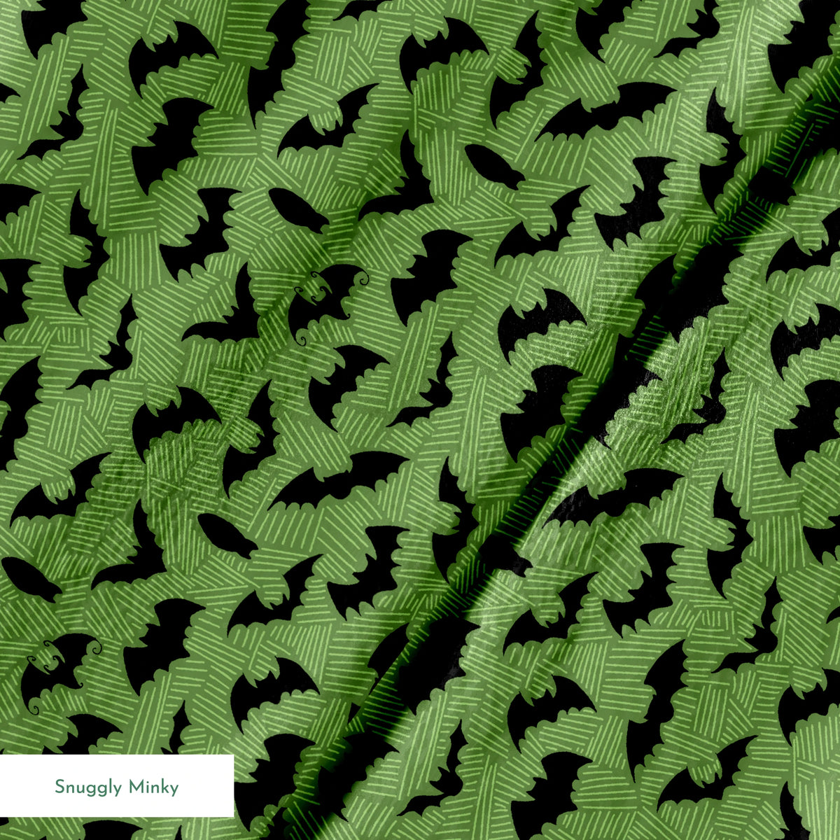 Black bat silhouettes scattered across a green textured background with zigzag pattern springs minky texture