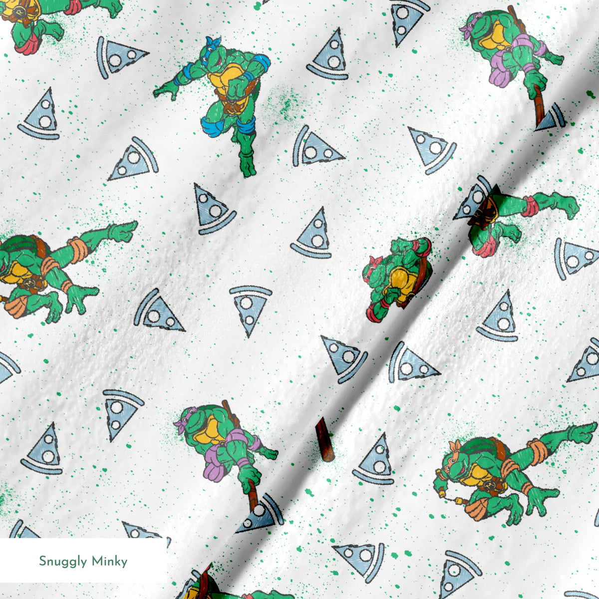 Teenage Mutant Ninja Turtles in action poses scattered among pizza slices on white speckled background springs minky texture