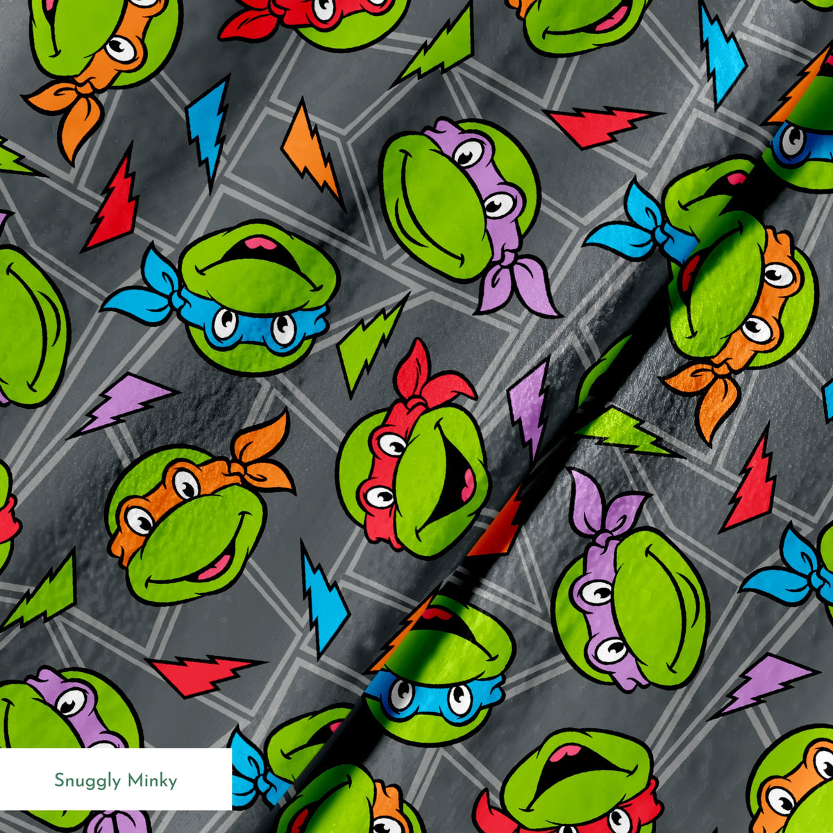 Colorful pattern of Teenage Mutant Ninja Turtles faces with red, orange, blue, and purple masks on grey background. springs minky texture