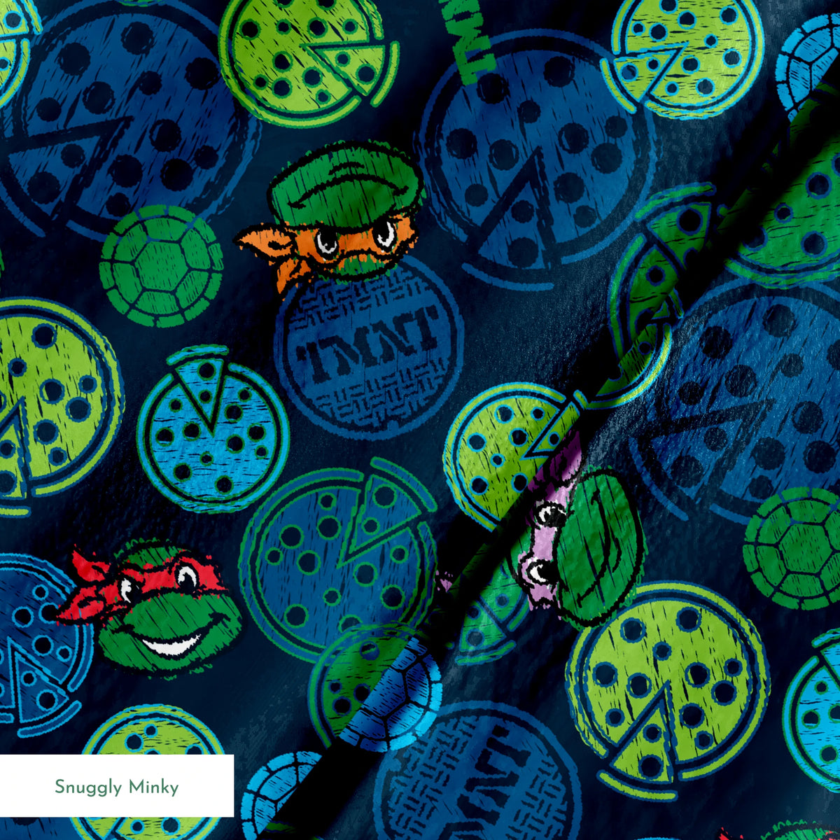 Teenage Mutant Ninja Turtles pattern with cartoon character heads and green/blue pizza circles springs minky texture