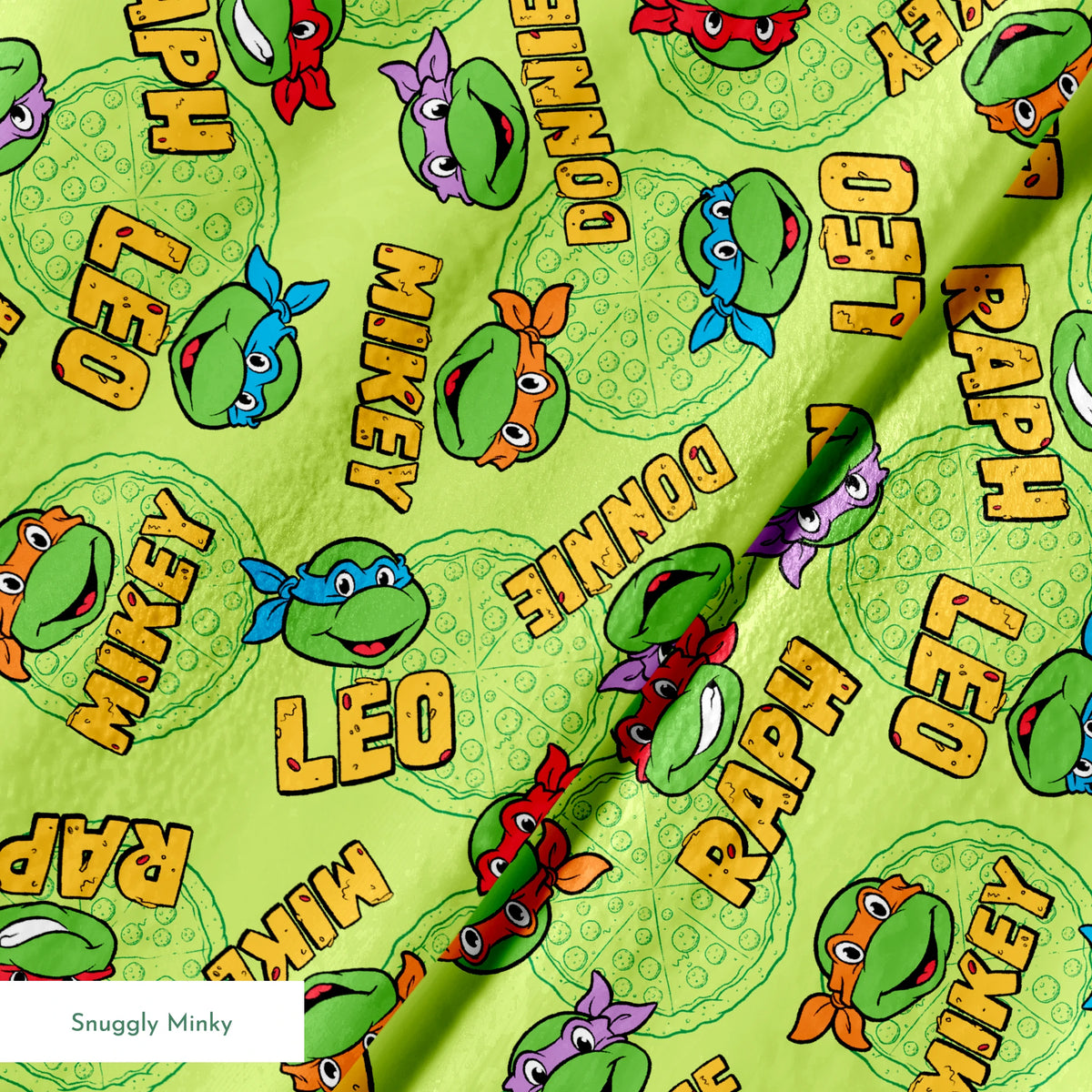 Teenage Mutant Ninja Turtles pattern with cartoon faces, names, and colorful masks on green background springs minky texture