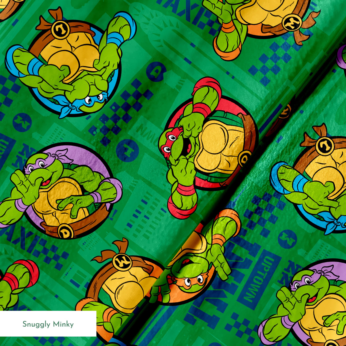 Teenage Mutant Ninja Turtles cartoon characters on green patterned background springs minky texture