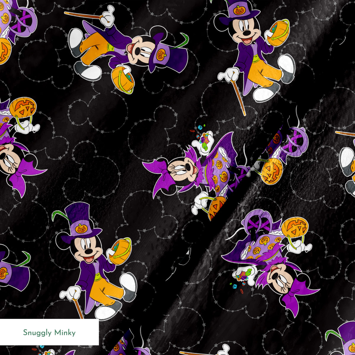 Mickey and Minnie in Halloween costumes on black background with purple, orange, and white details in a scattered pattern springs minky texture