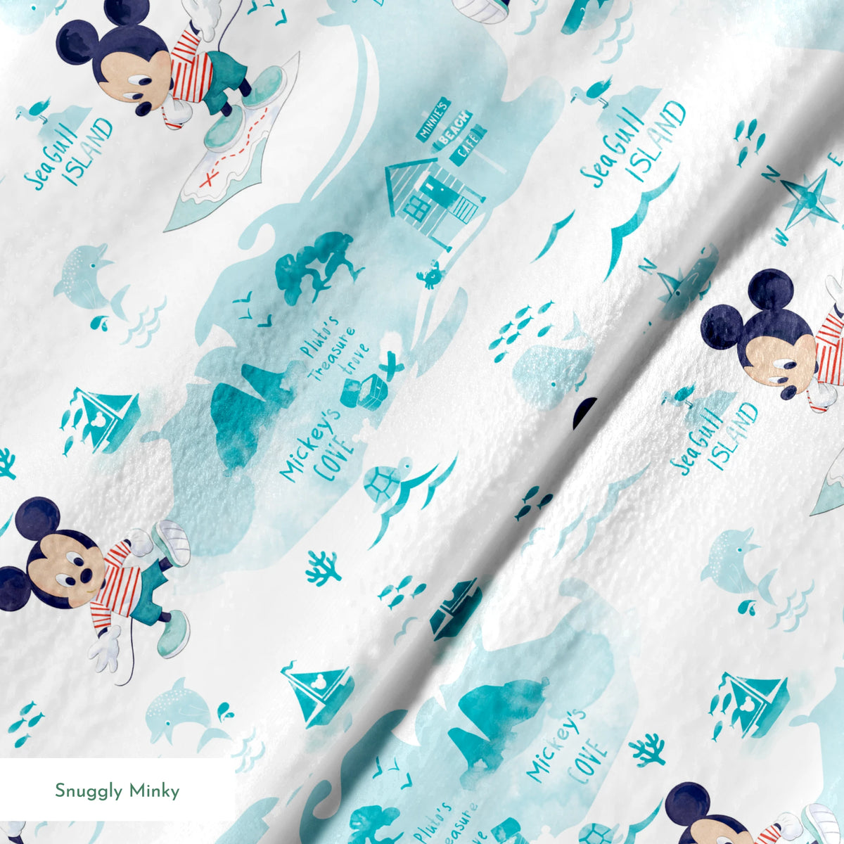 Cartoon Mickey Mouse pattern with turquoise ocean elements, sharks, waves, and "Safari" text springs minky texture