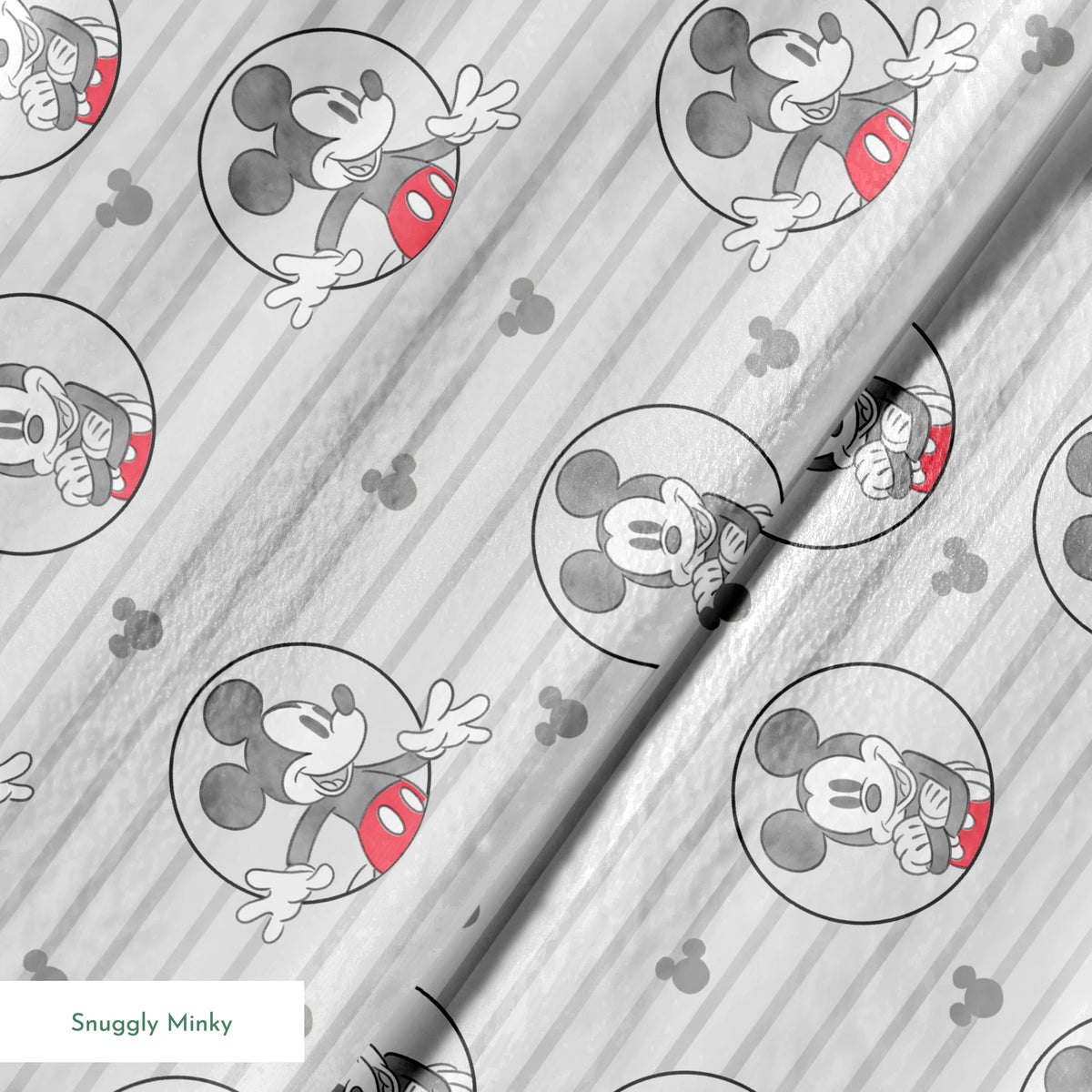 Mickey Mouse pattern on gray striped background with circular character portraits in red, black, and white springs minky texture