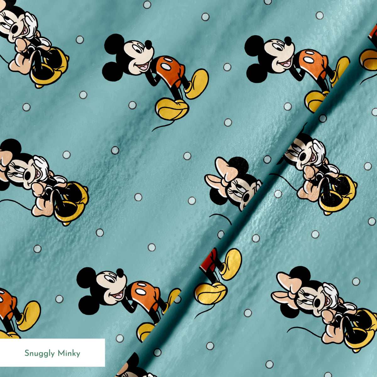 Cartoon pattern of Mickey and Minnie Mouse characters on light blue background with white dots springs minky texture