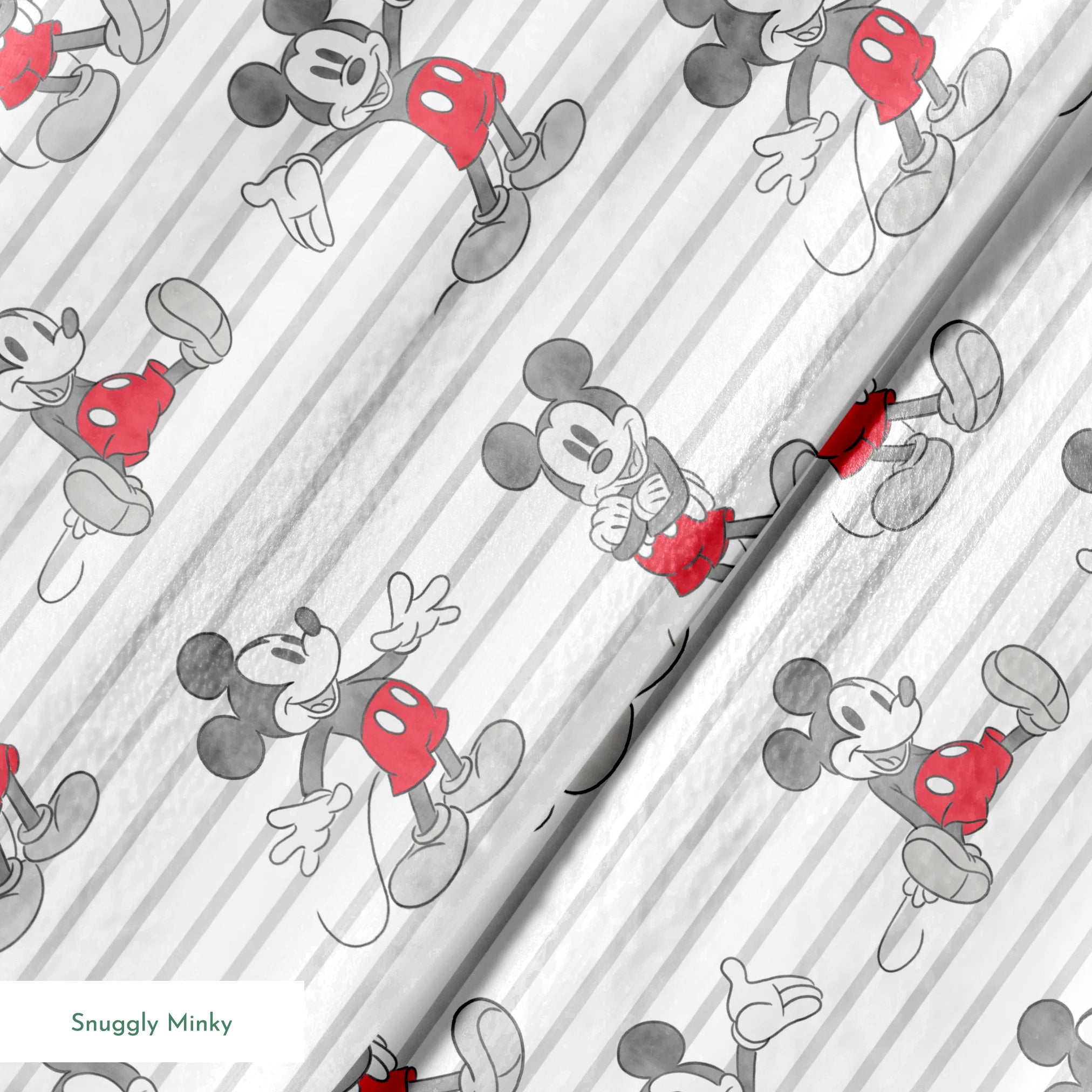 Mickey Mouse cartoon characters in various poses on gray and white striped background springs minky texture