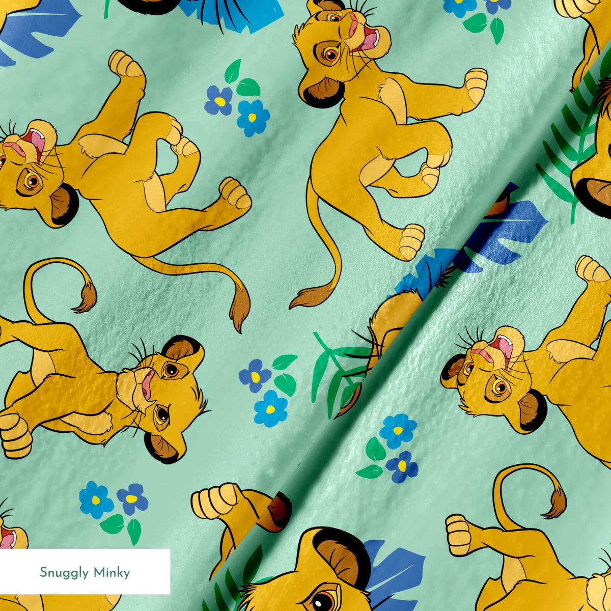 Cartoon lion cubs playing on mint green background with blue flowers and green leaves pattern springs minky texture