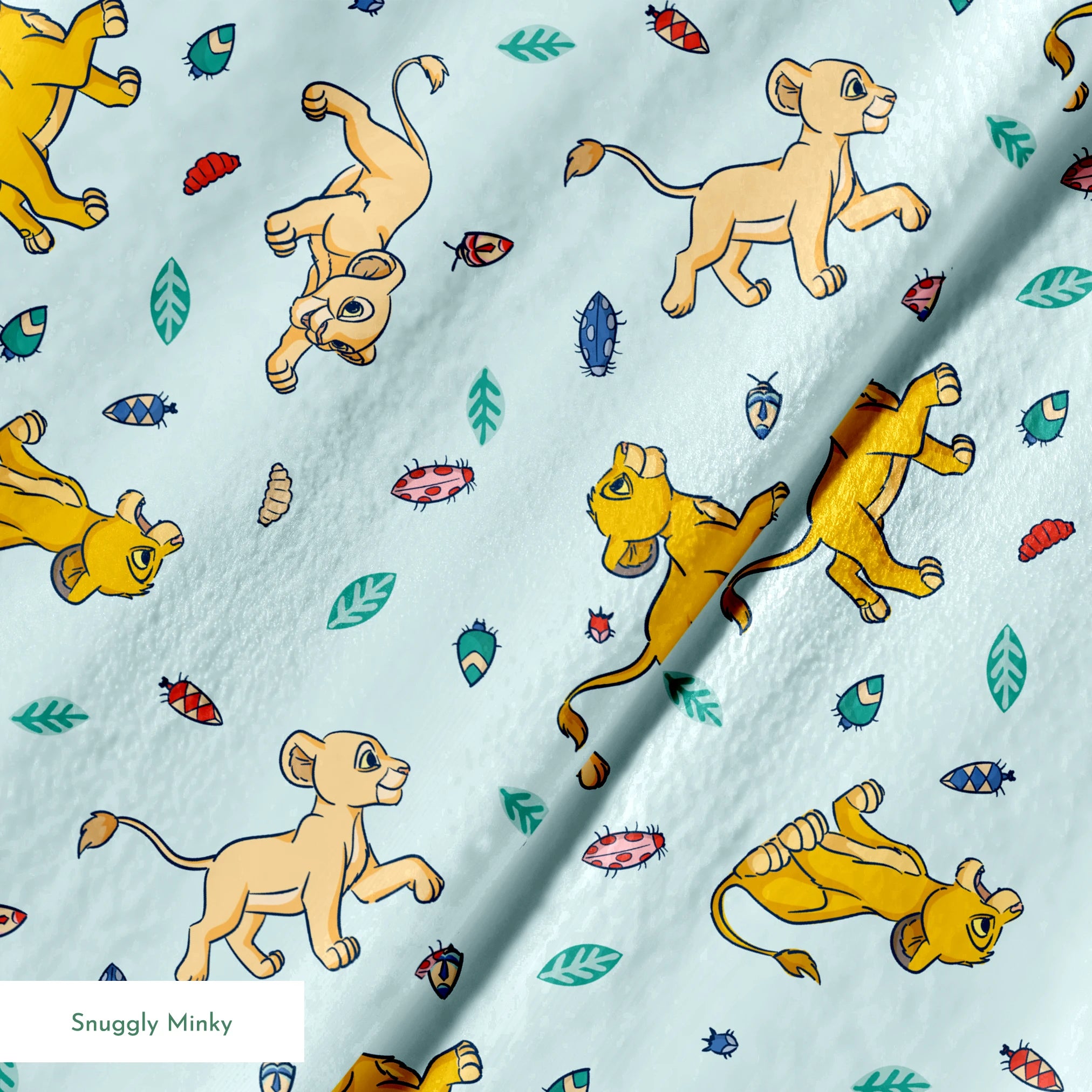 Lion cubs playing on light blue background with colorful leaves and plant elements scattered throughout springs minky texture