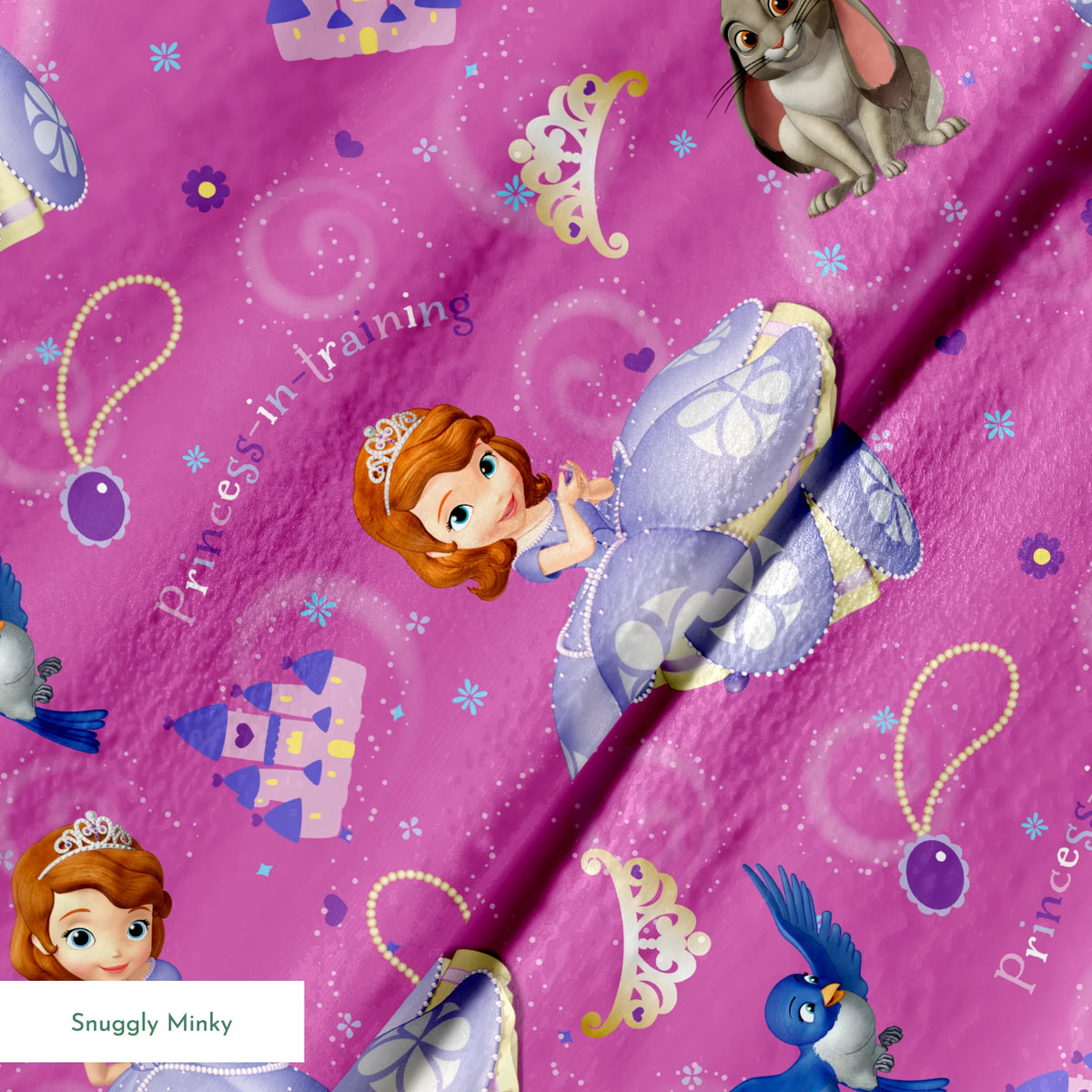 Princess Sofia pattern with purple background, crowns, castles, rabbits, and blue birds scattered among swirling designs springs minky texture