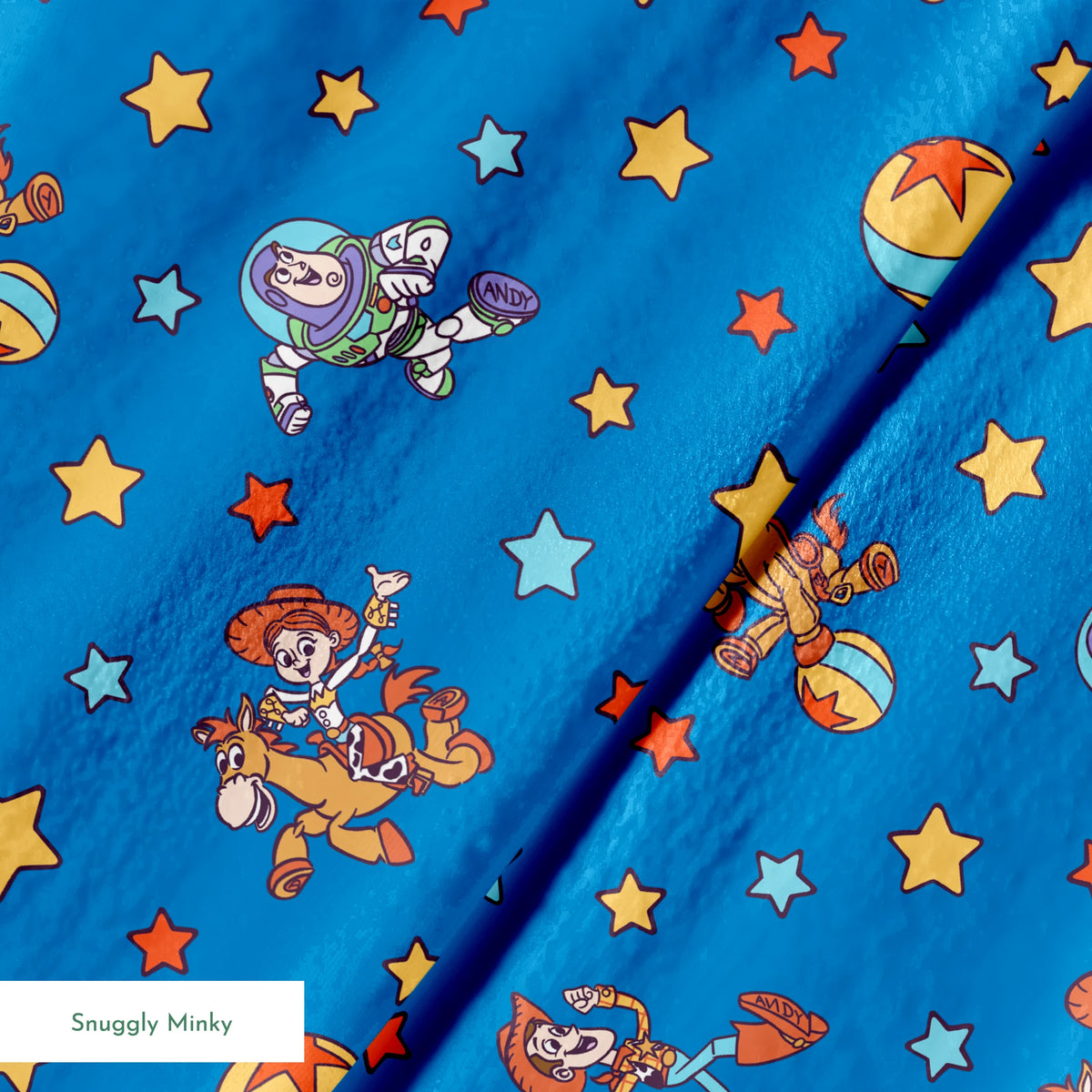 Toy Story characters floating in space pattern with stars on blue background springs minky texture