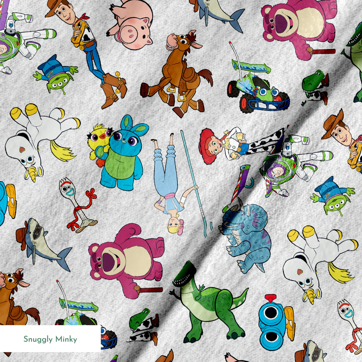 Colorful pattern of various animated Toy Story characters on a light speckled background springs minky texture