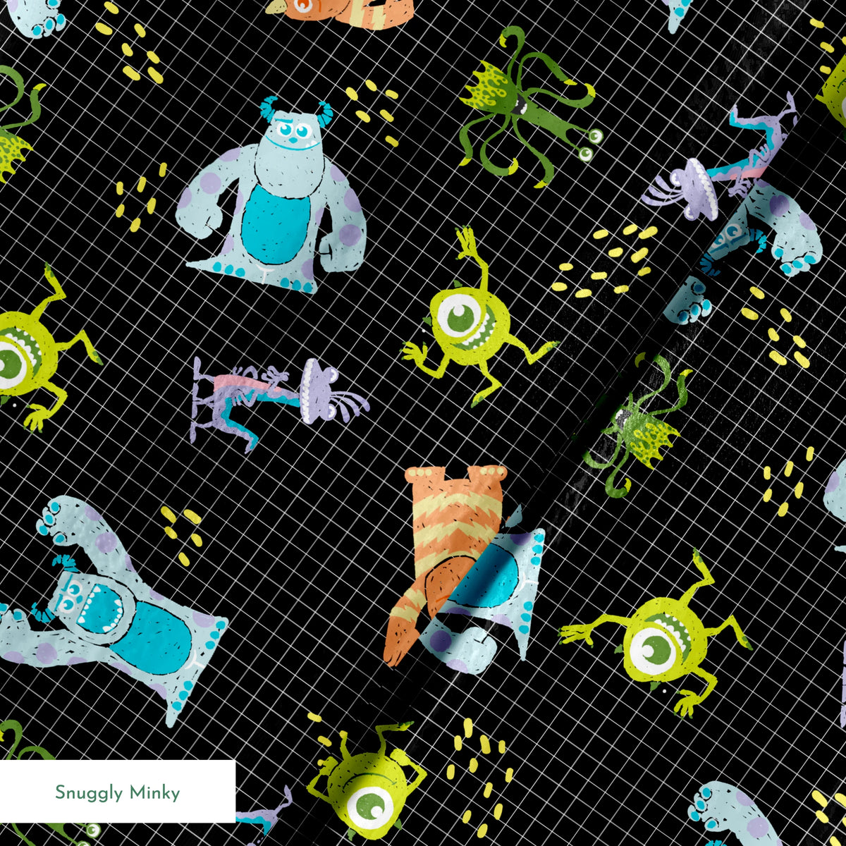 Monsters Inc pattern with Sulley, Mike, & friends on black grid background springs minky texture