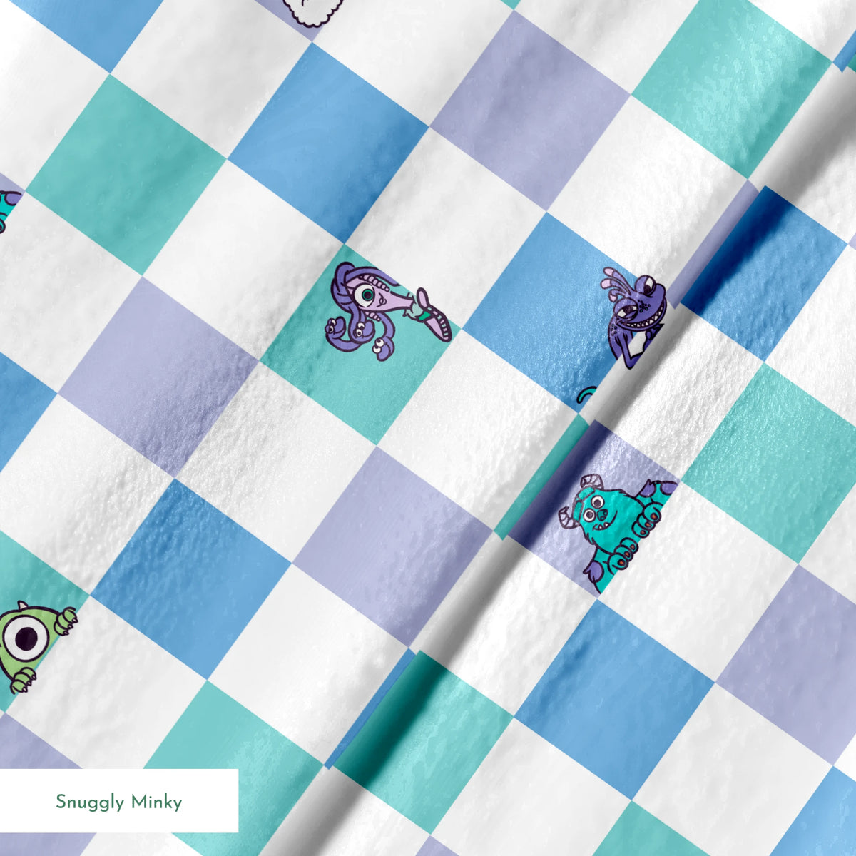 Monsters Inc characters on a checkered pattern of white, mint green, light purple, and blue squares springs minky texture
