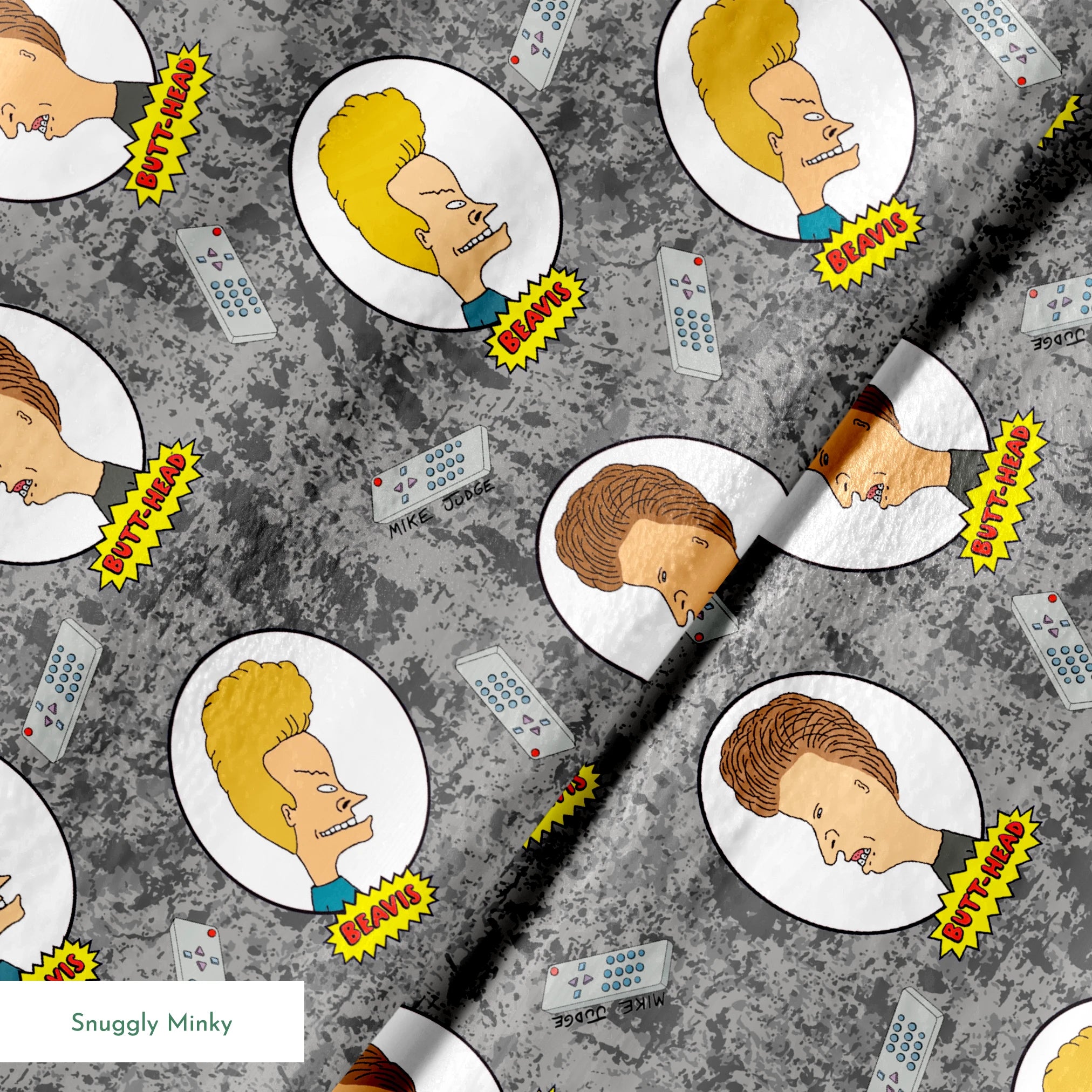 Cartoon pattern with blond and brown-haired animated characters in circular frames against a gray background with comic-style text bubbles. springs minky texture