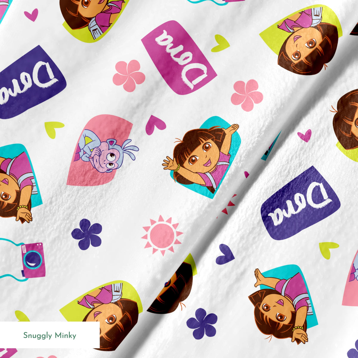 Cartoon pattern featuring Dora the Explorer characters, purple logos, pink hearts, and flowers on white background. springs minky texture