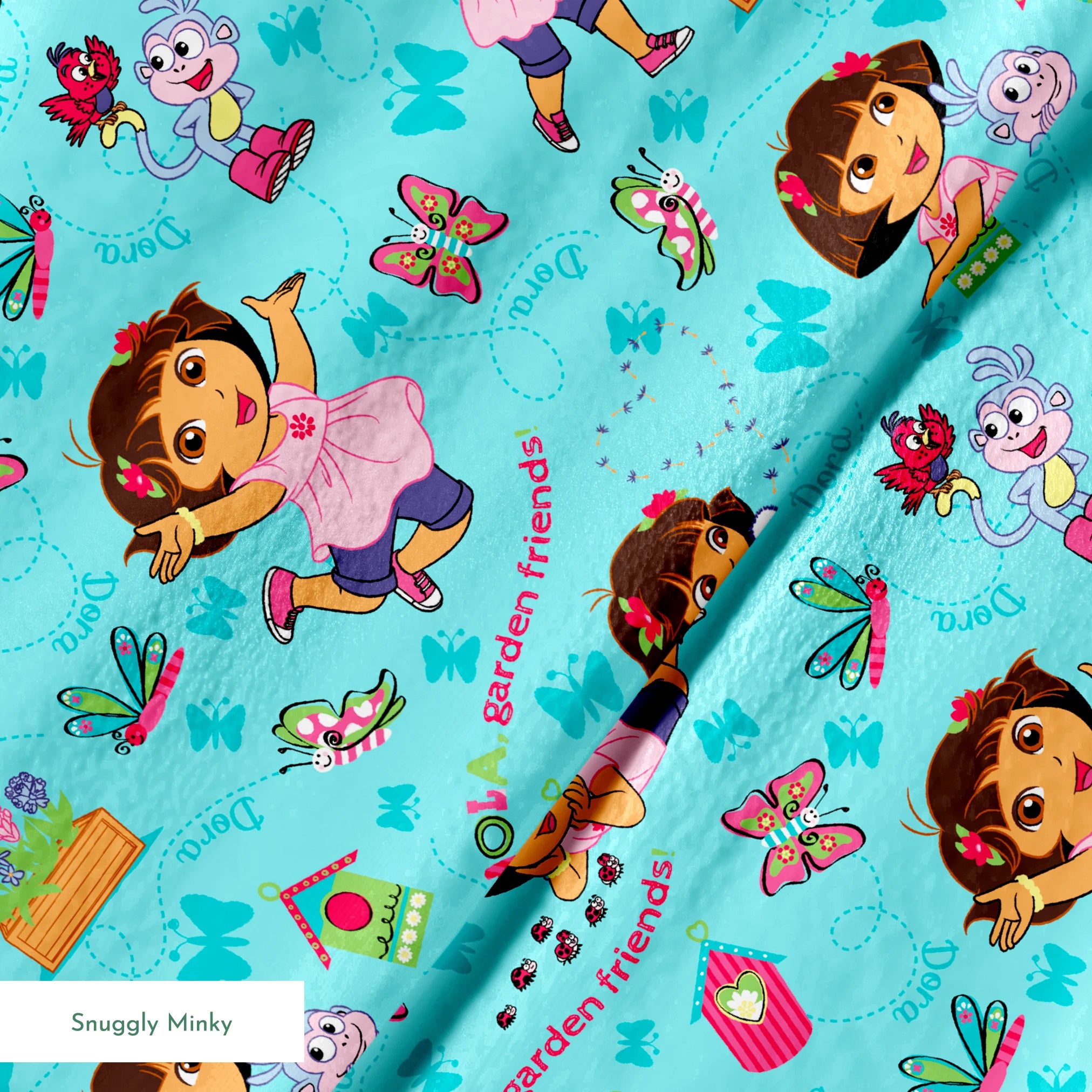 Colorful Dora the Explorer pattern on light blue background springs minky texture
