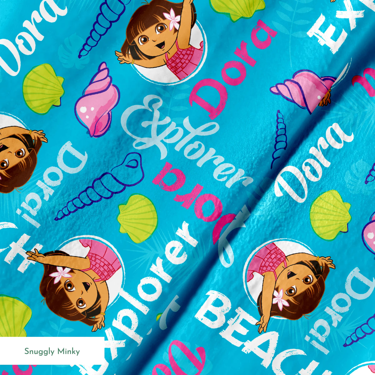 Bright blue pattern featuring Dora the Explorer cartoon character with seashells and "Beach Explorer" text springs minky texture