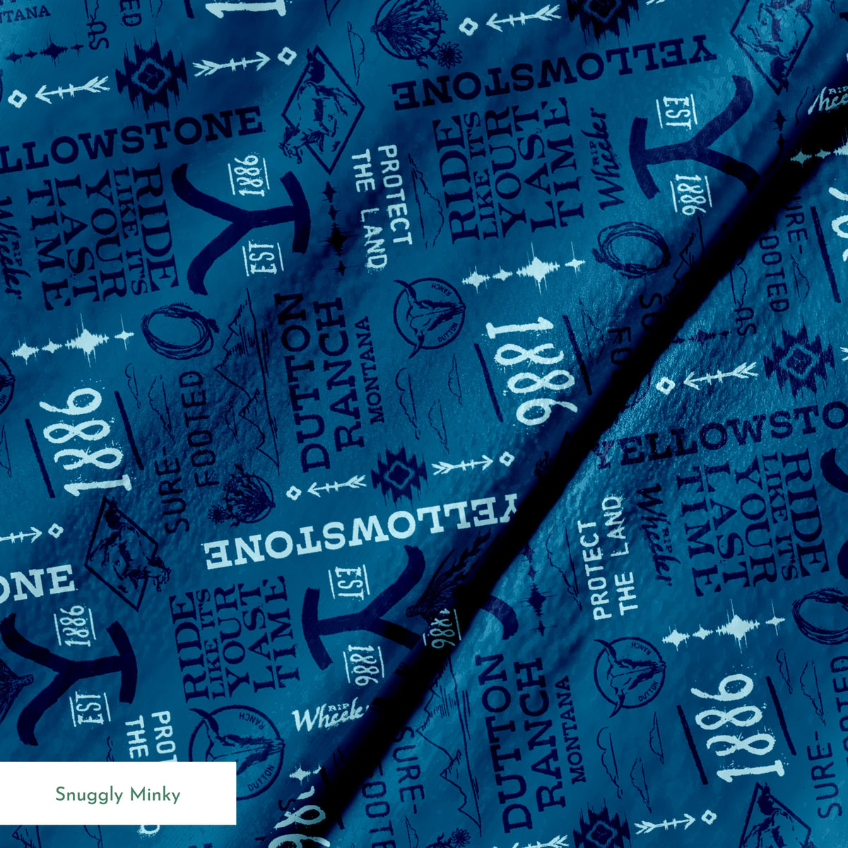 Paramount Yellowstone Verbiage Collage on Blue Fabric