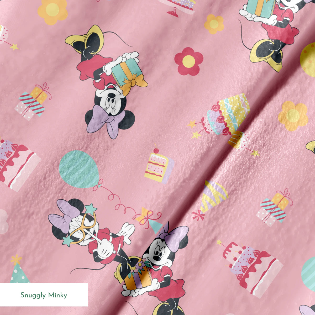 Minnie Mouse pattern on pink background with cakes, candy, and desserts scattered throughout.