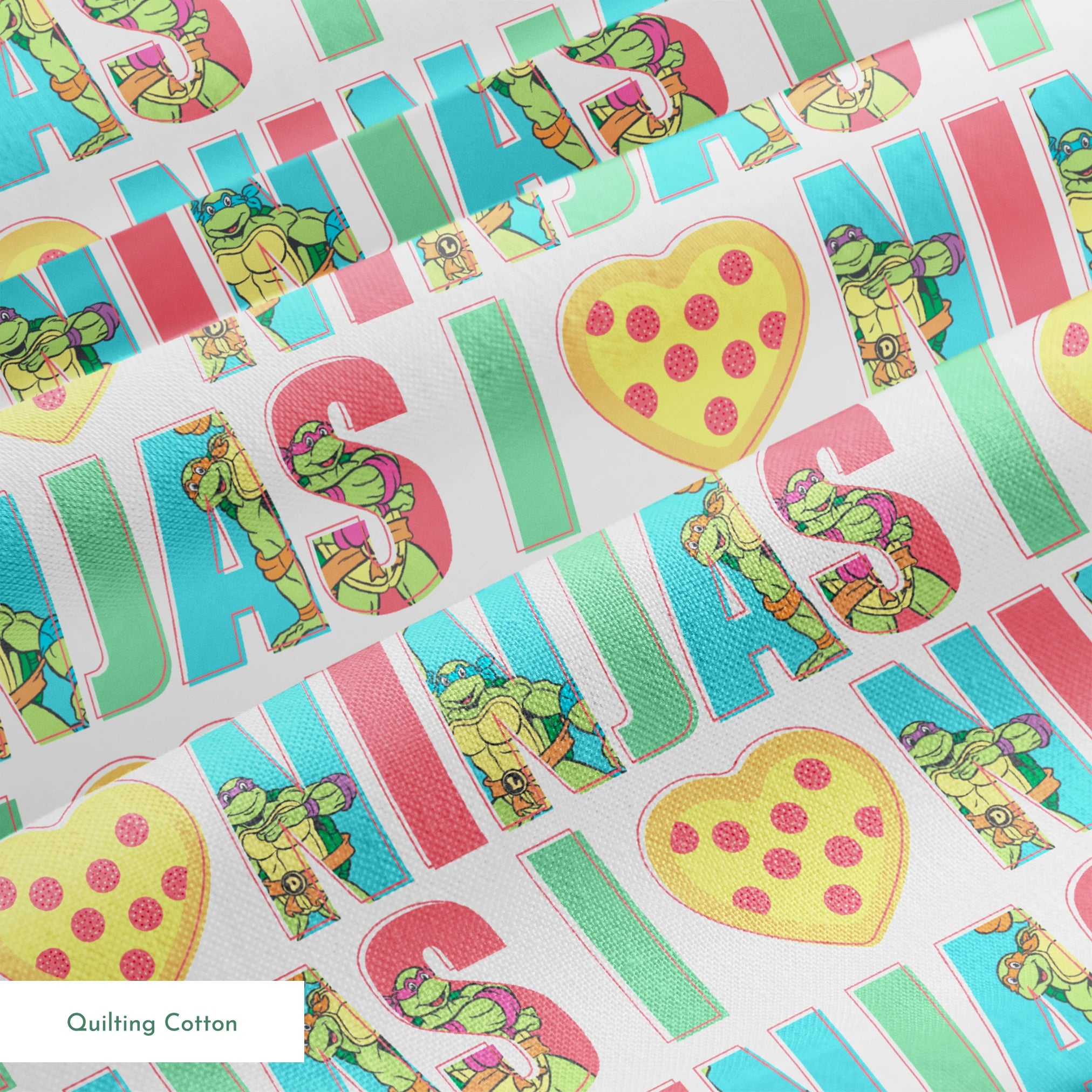 Teenage Mutant Ninja Turtles design with “I heart Ninjas” text with a pizza heart graphic, and Michelangelo and Leonardo in pastel colors. springs quiltingcotton texture