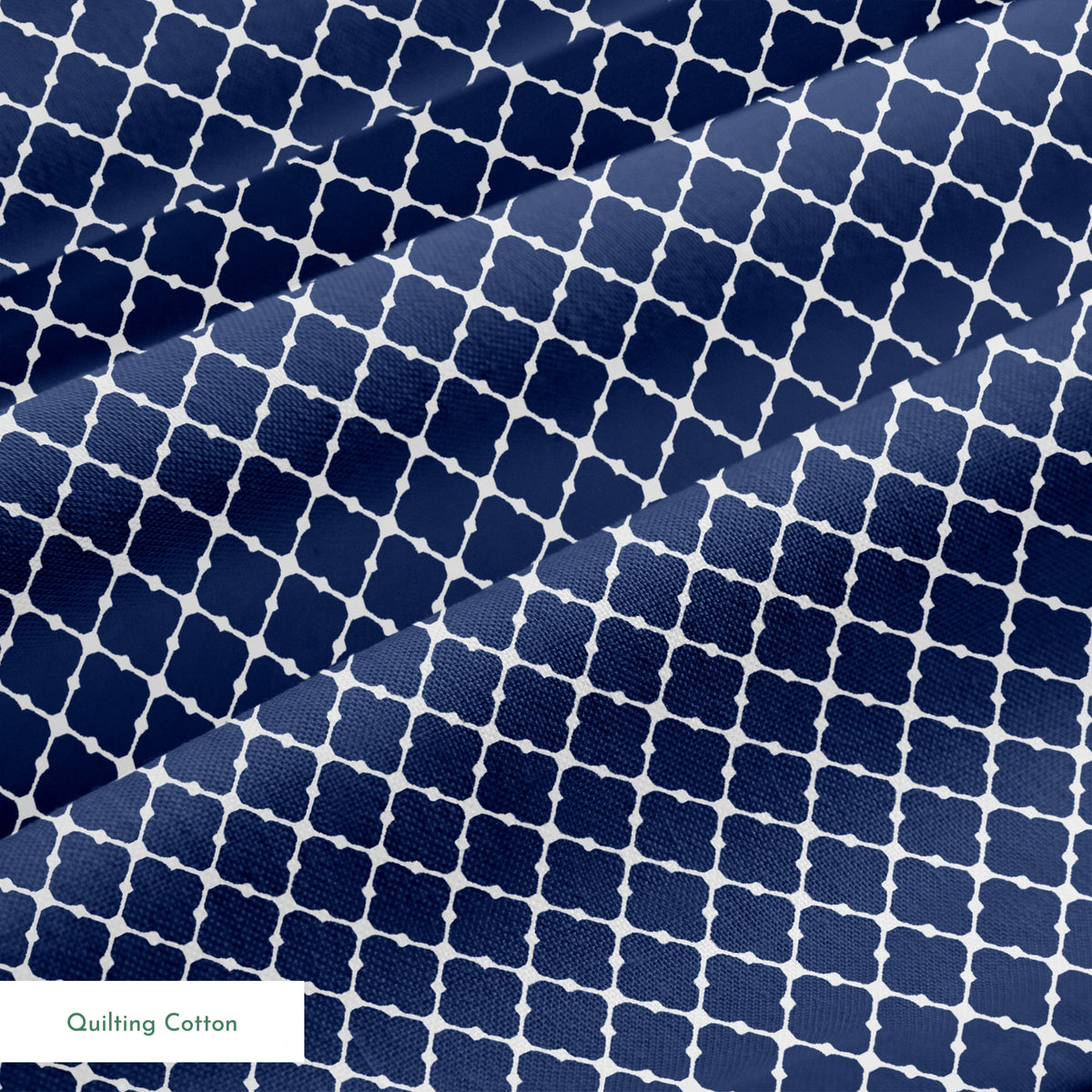 Navy blue quatrefoil pattern with white lattice design on dark background springs quiltingcotton texture