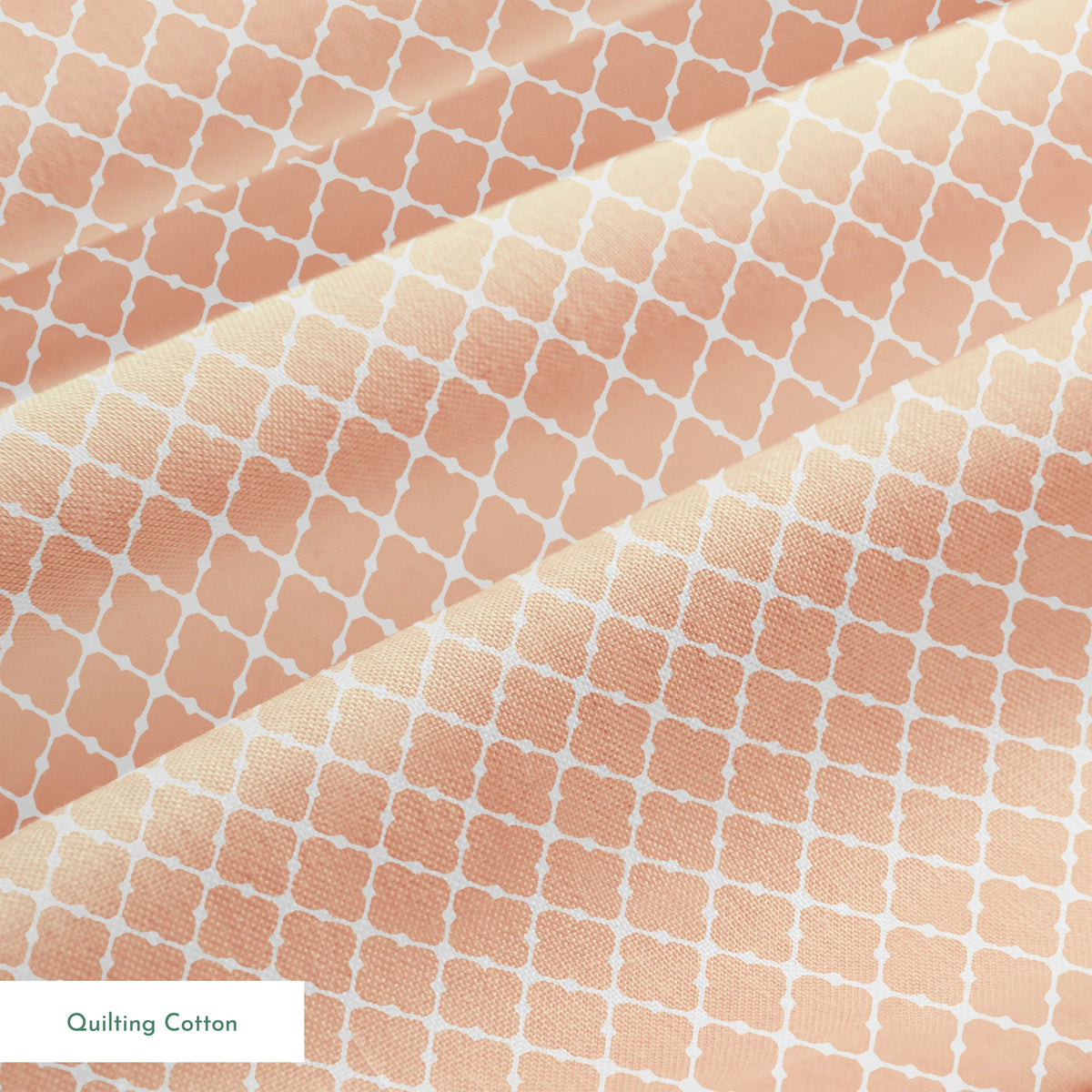 Peach and white quatrefoil pattern with regular geometric shapes in a lattice arrangement springs quiltingcotton texture