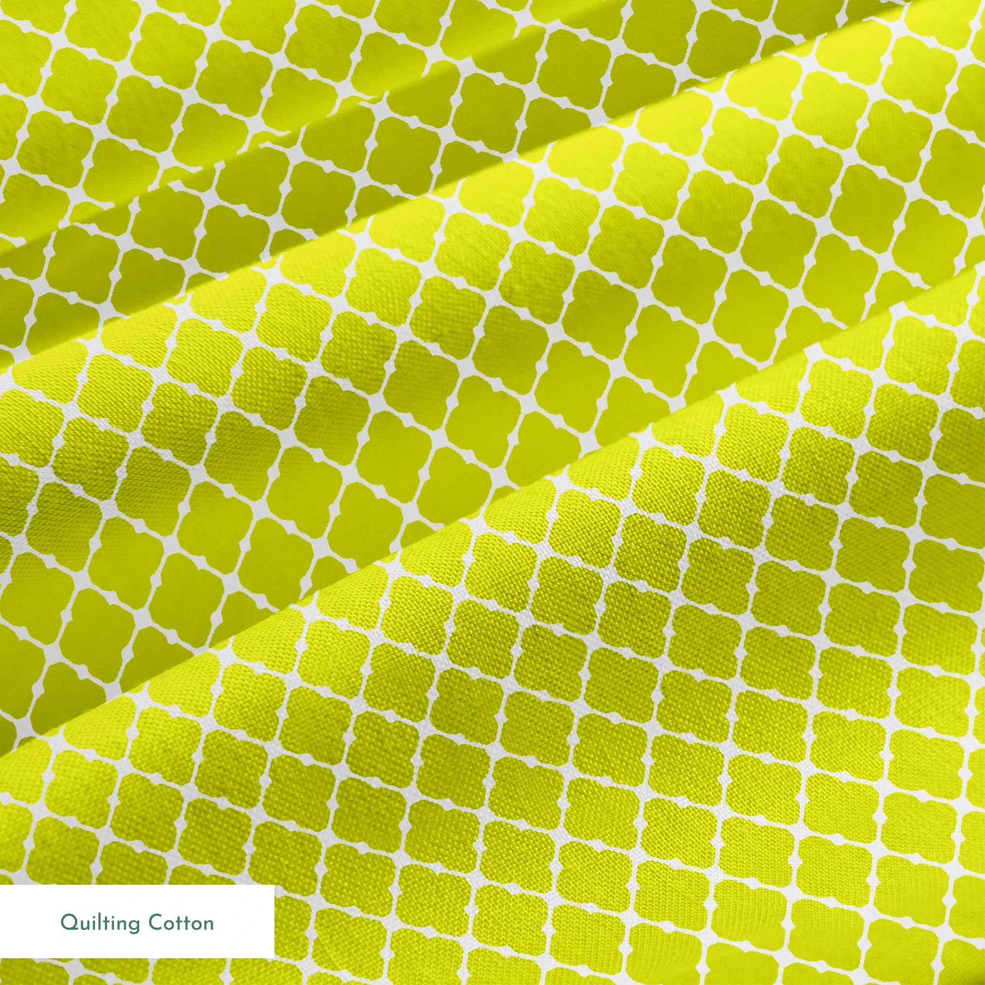 Chartreuse green quatrefoil pattern on white background, forming a geometric lattice design springs quiltingcotton texture