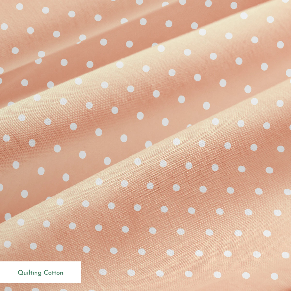 White circles on a peach/salmon colored background springs quiltingcotton texture