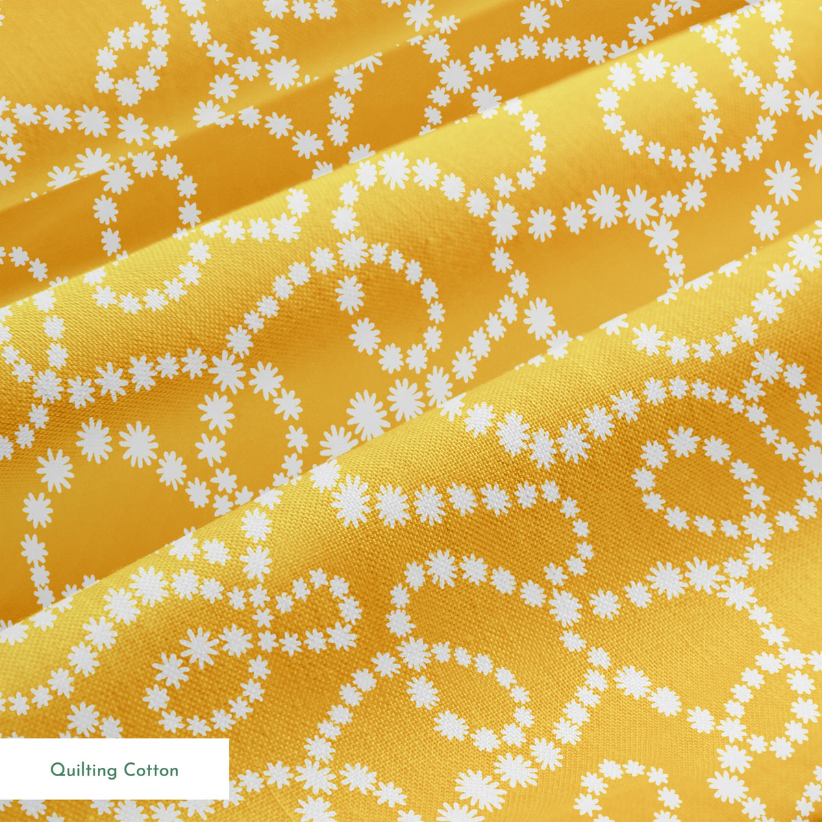 Mustard yellow background with swirling dotted white patterns forming organic circular designs springs quiltingcotton texture