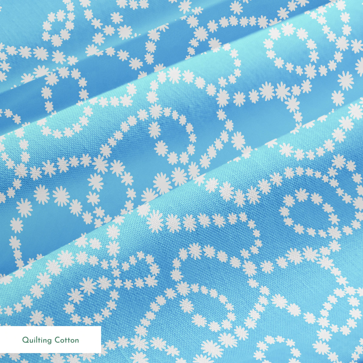Sky blue background with swirling white dotted pattern resembling beaded strings or pearls arranged in curving lines springs quiltingcotton texture