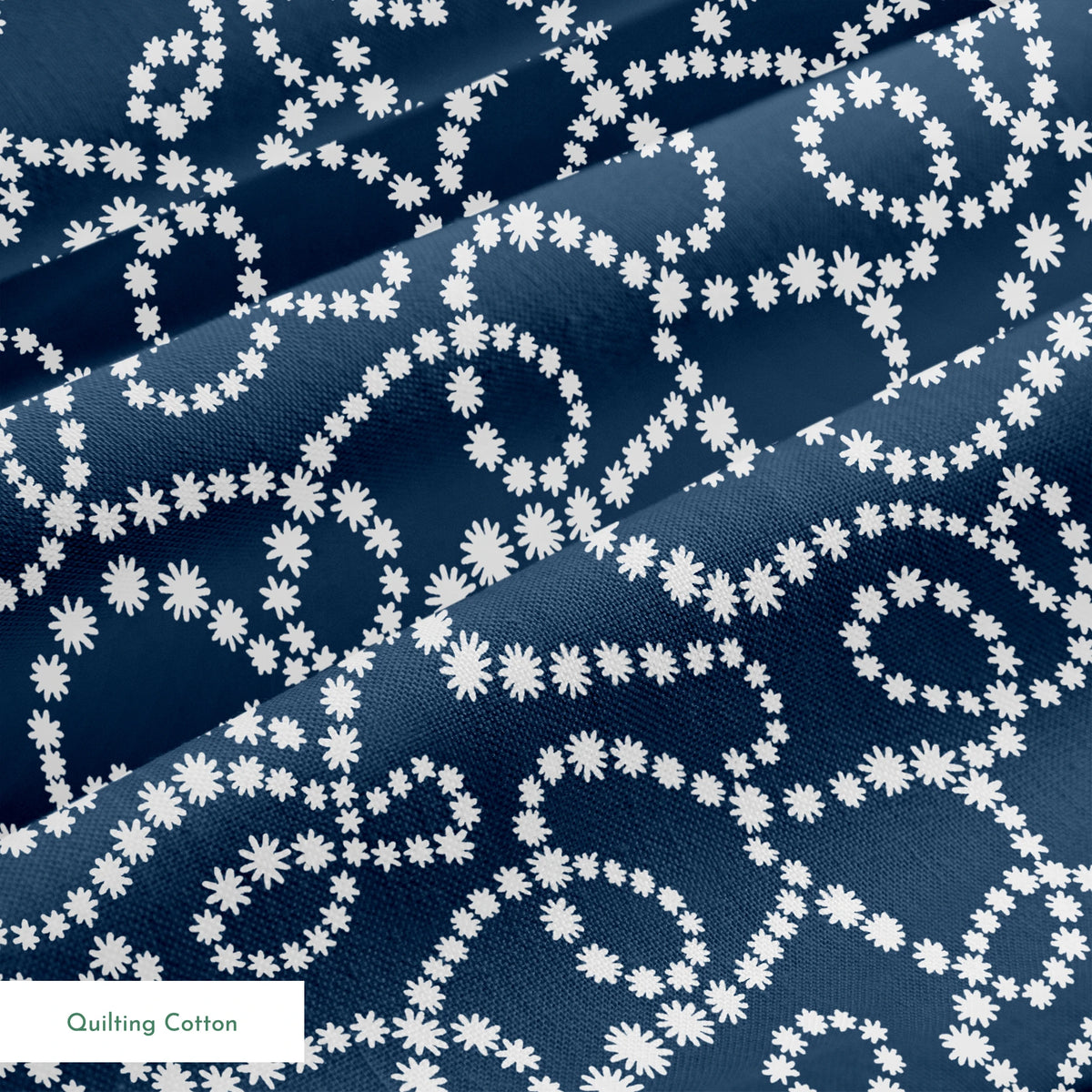 Navy blue background with swirling white dotted patterns creating circular and flowing designs springs quiltingcotton texture