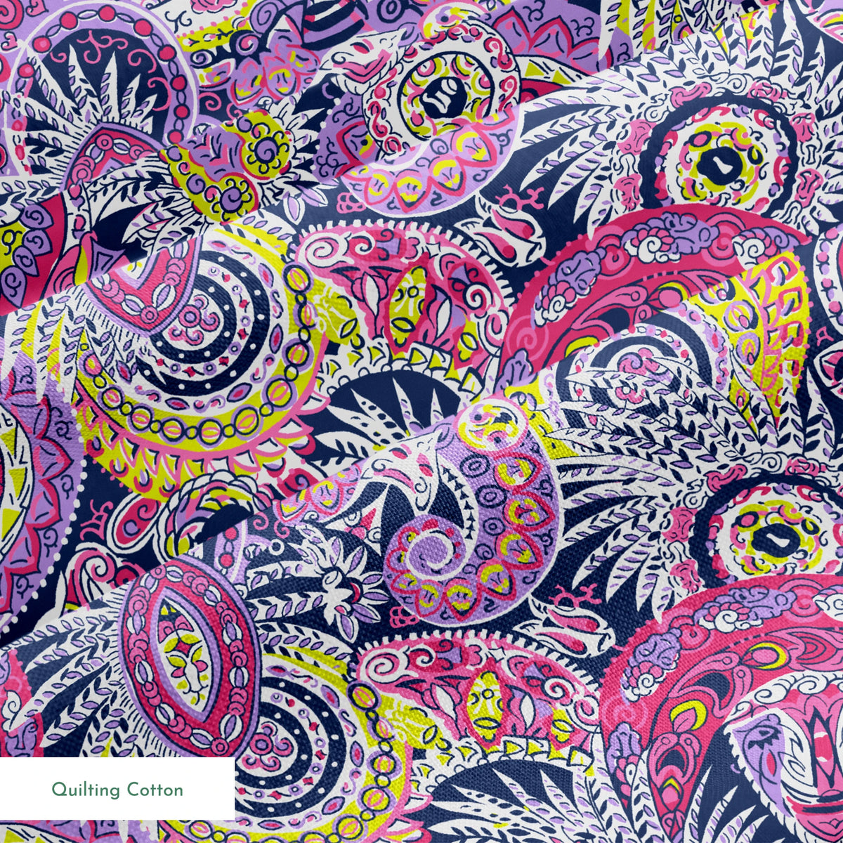Vibrant paisley pattern in pink, purple, yellow, and blue with intricate swirling designs springs quiltingcotton texture