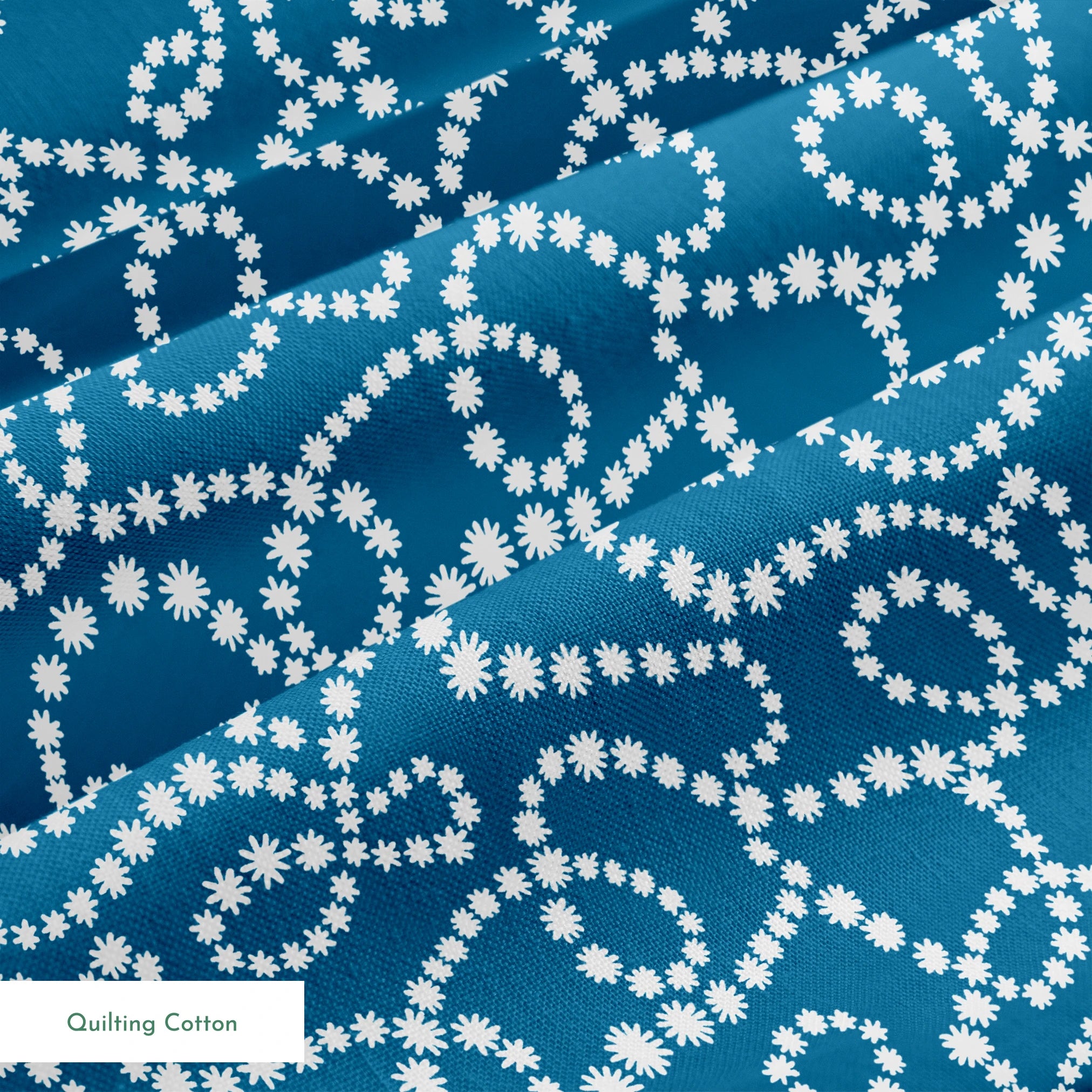 Dotted white swirling patterns on deep teal blue background creating abstract curved designs springs quiltingcotton texture