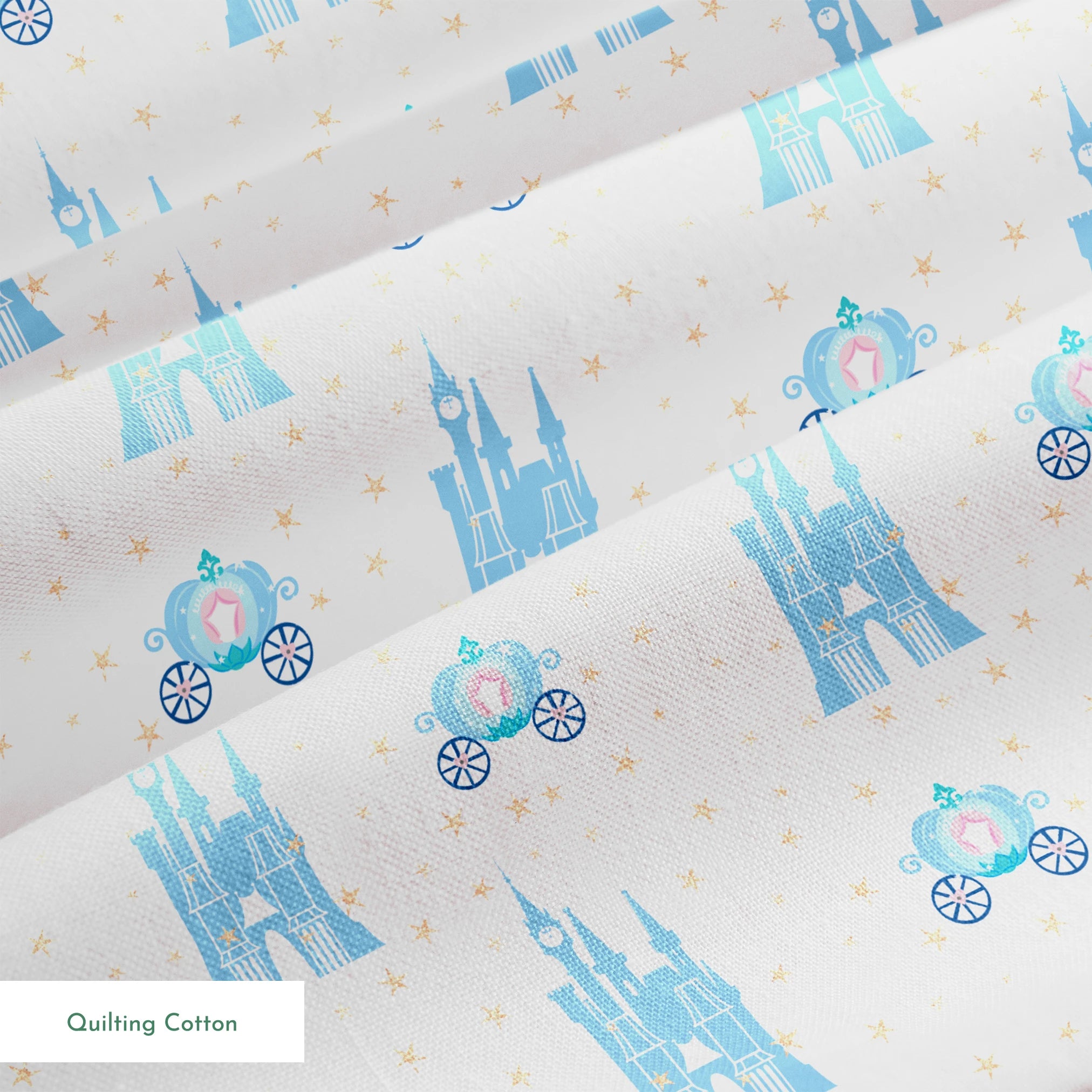 Cinderella pattern with blue castles, carriages, and gold stars on pale pink background springs quiltingcotton texture