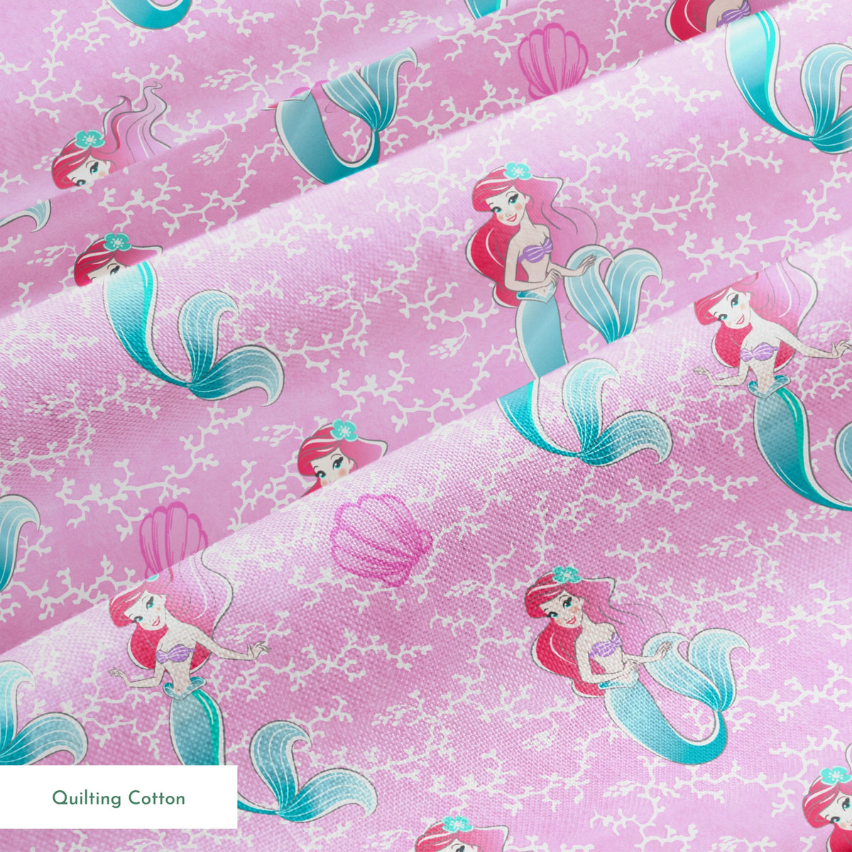 The Little Mermaid pattern with Ariel and purple seashells on pink background with white bubbles springs quiltingcotton texture